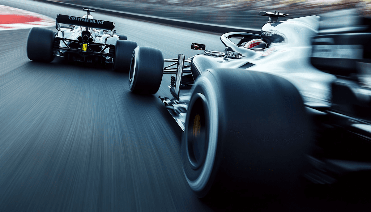 Two racing cars compete closely on a track, showcasing dynamic angles and blurred motion for speed effect.