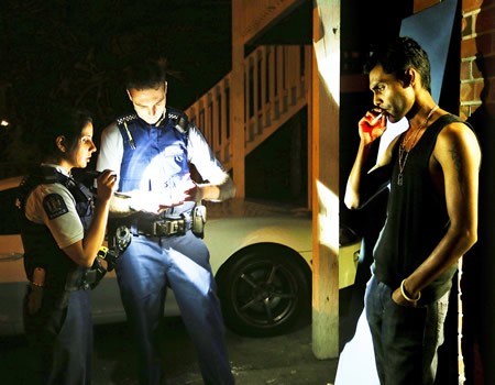 a man sitting on the floor in front of a window