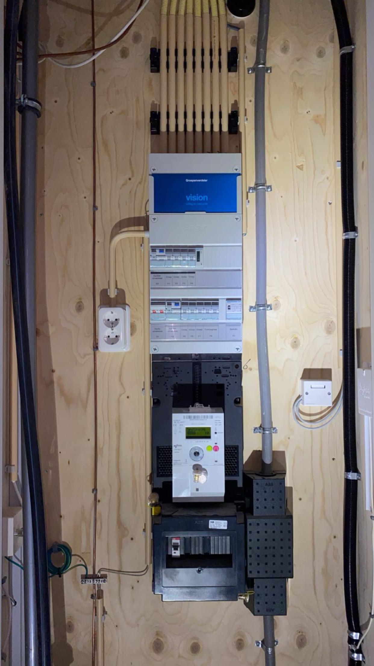 Rooftop garden with trees and plants, overlooking a cityscape at sunset with a tall building in the background
