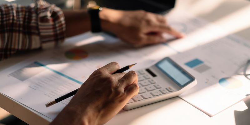 An entrepreneur doing calculations for his business