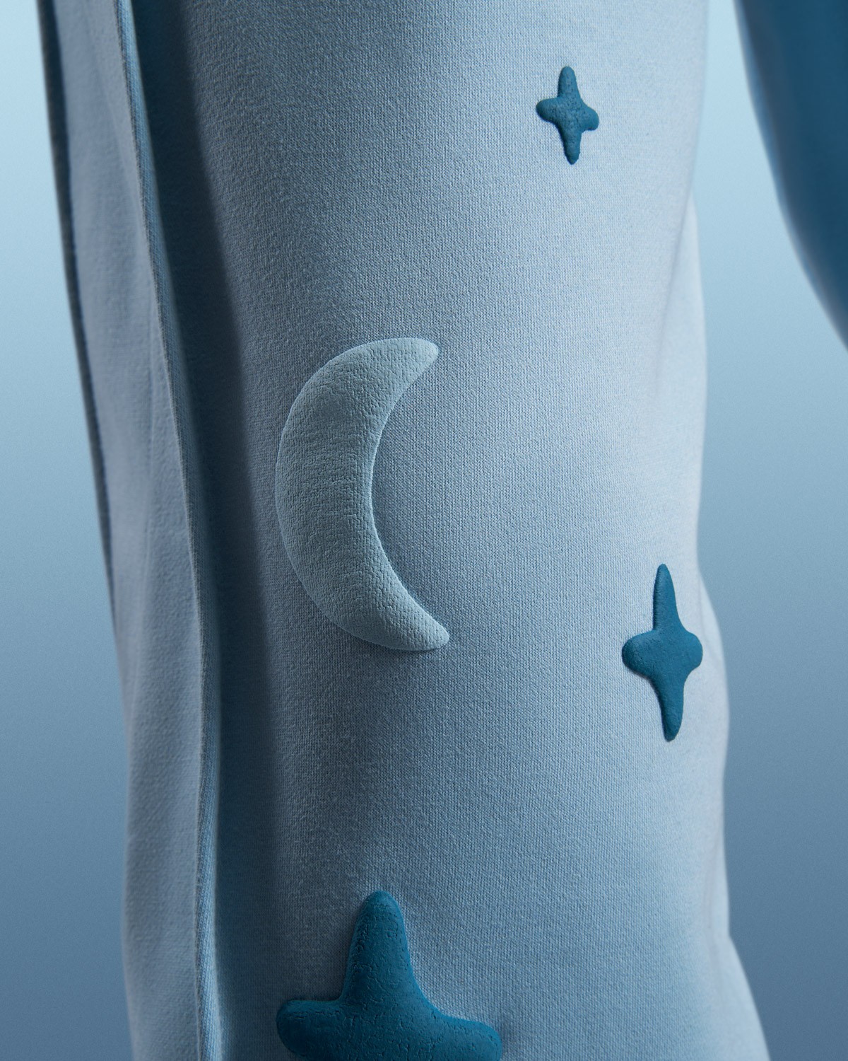 Tuko Clothing blue Dandadan inspired tracksuit detail shot photographer by Matthew Brown (London product photographer).