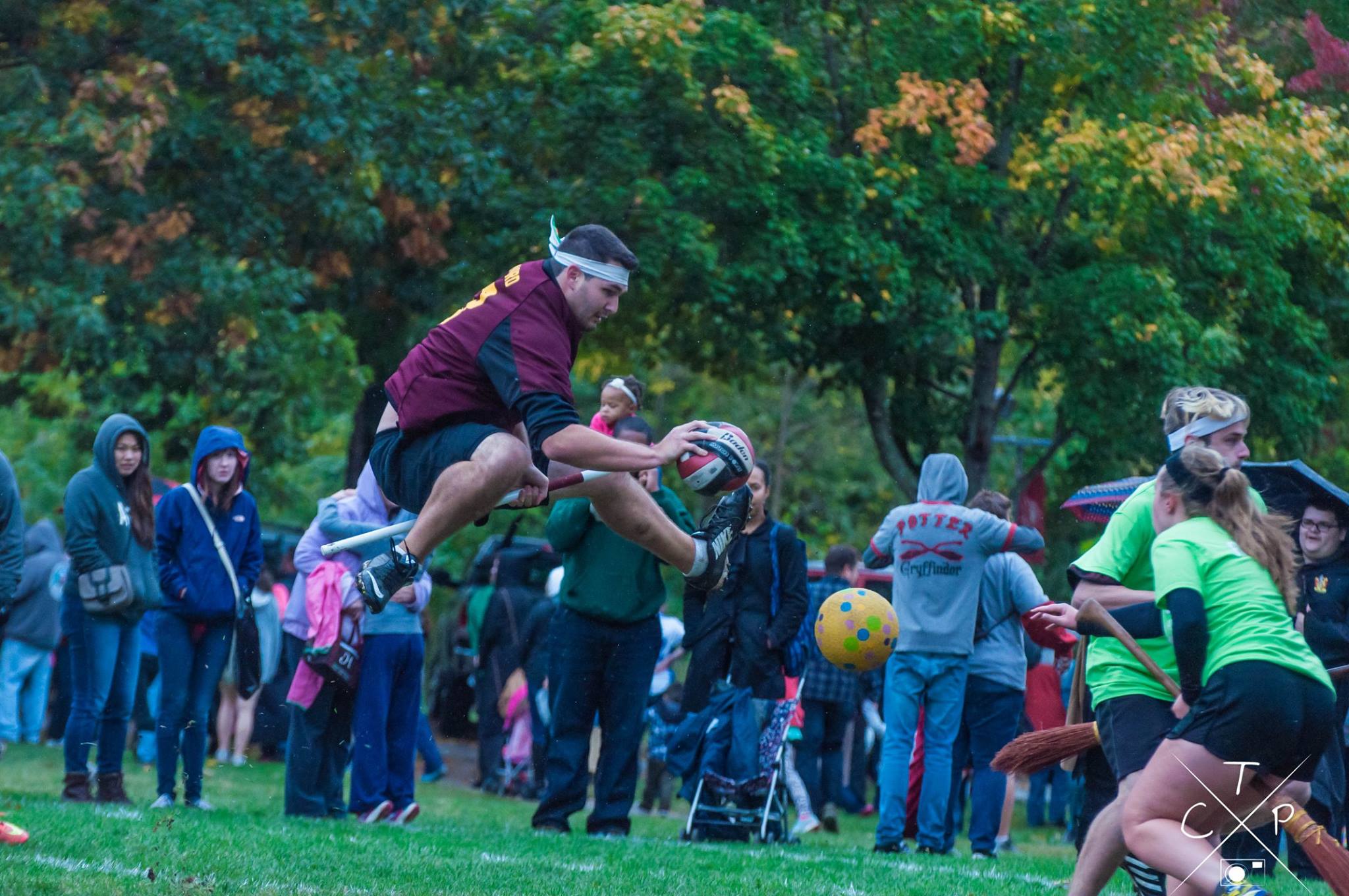 A ball-carrying chaser with the quadball jumps to dodge a beat