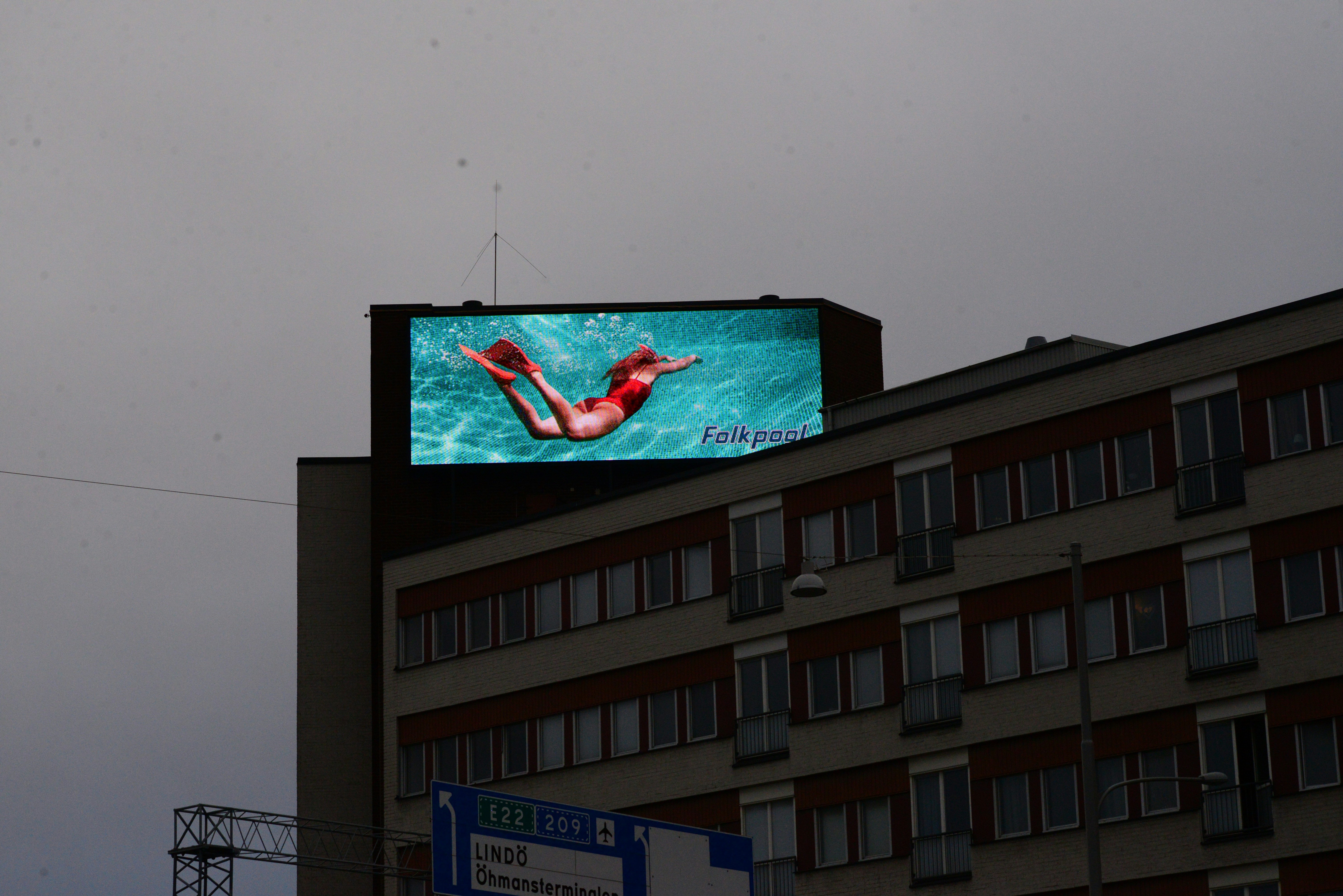a building with a large screen on top of it