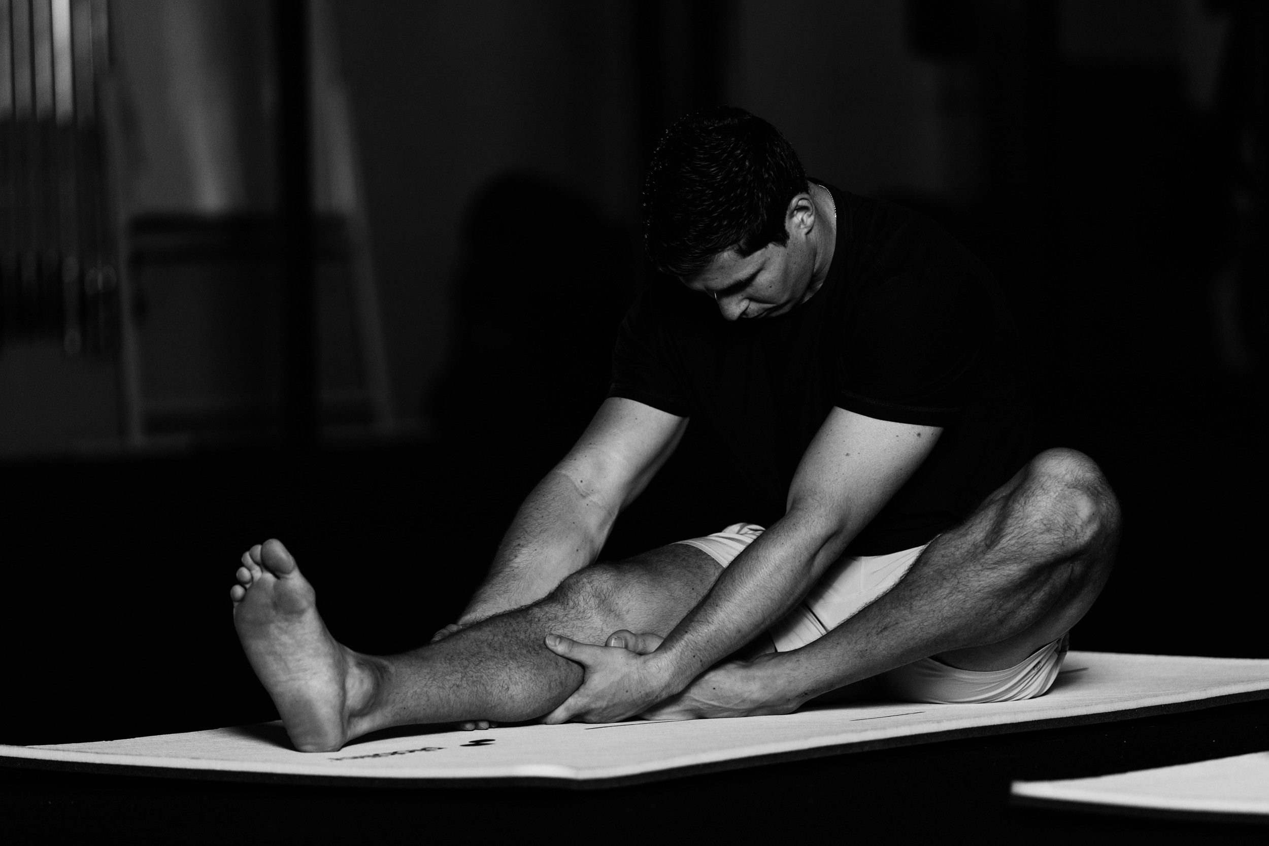 man warming up - How to Test Hip Mobility