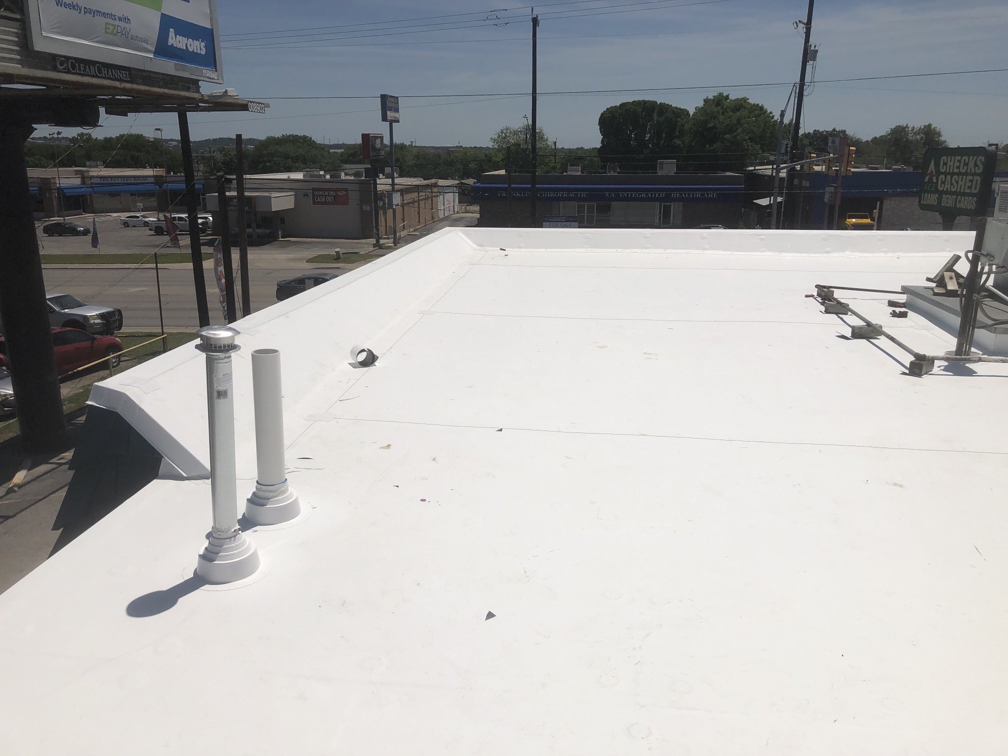 Rooftop details from our San Antonio job. Equipment curbs and penetrations need their own flashing details.