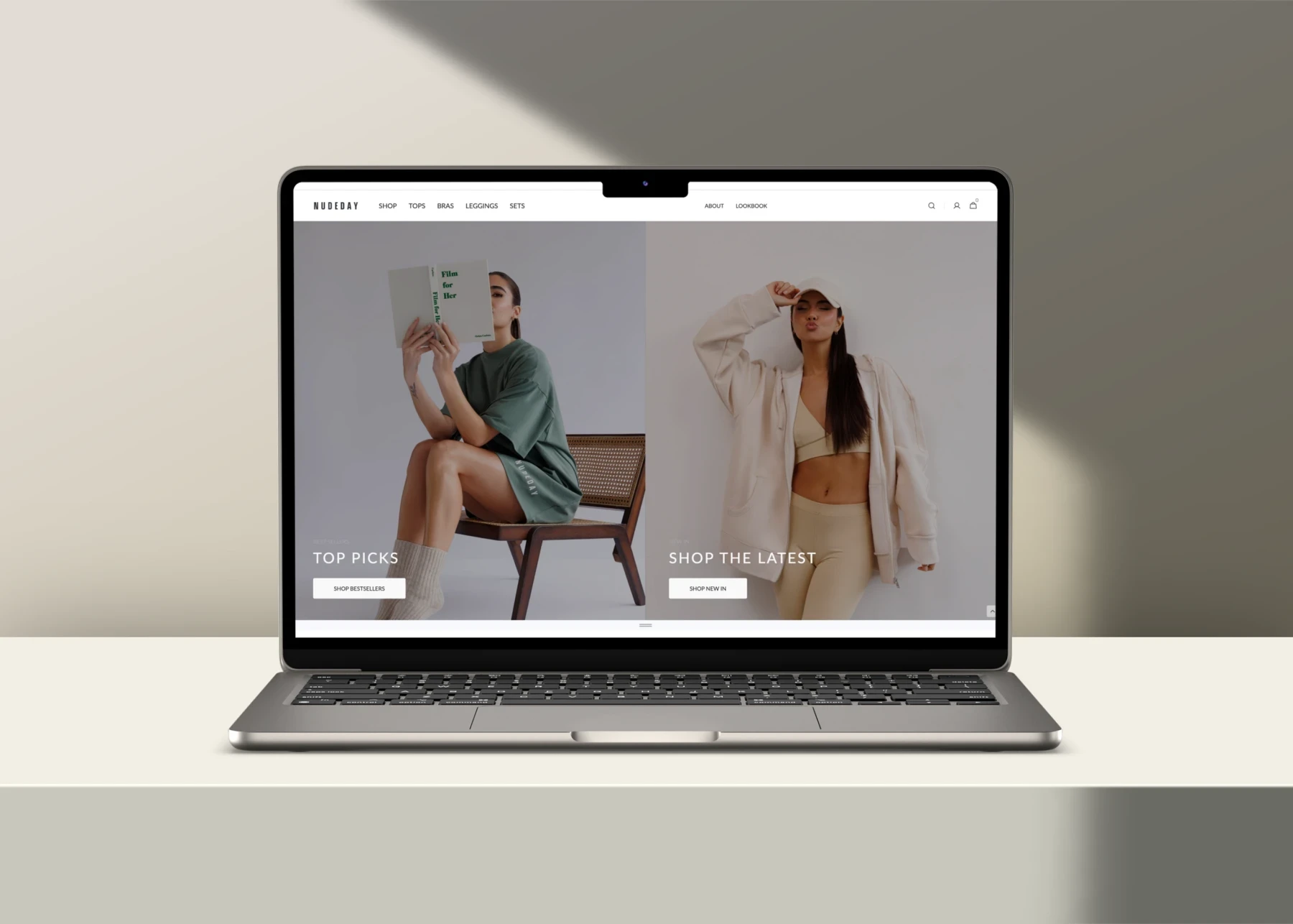 Laptop showing a website design for Nude Day Clothing