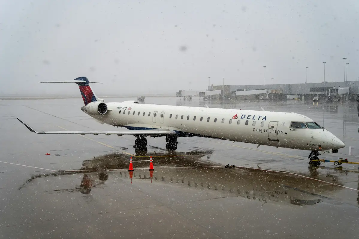 a plane on runway and snowy weather