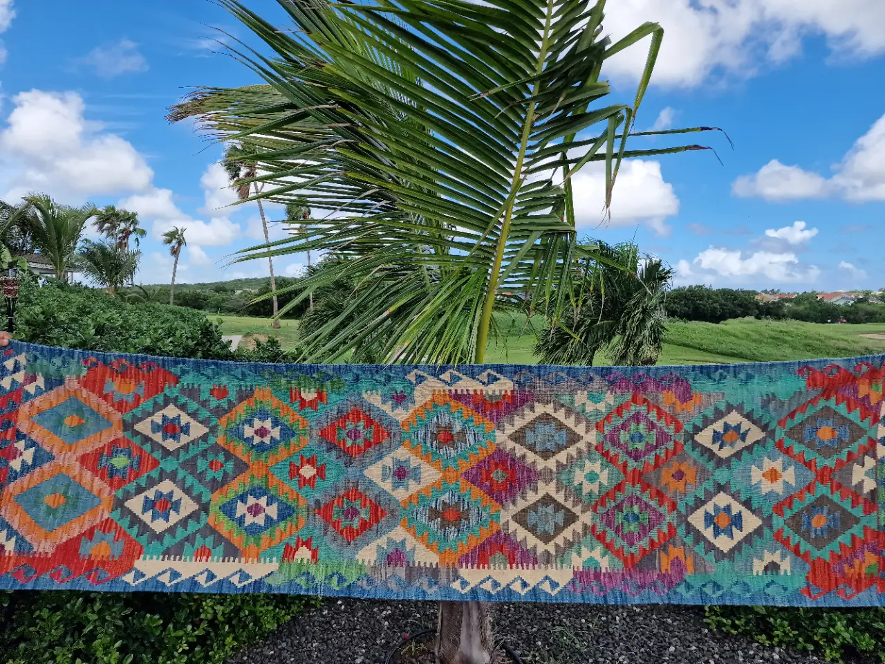 Floor Art Caribbean picture with a carpet before a palm tree