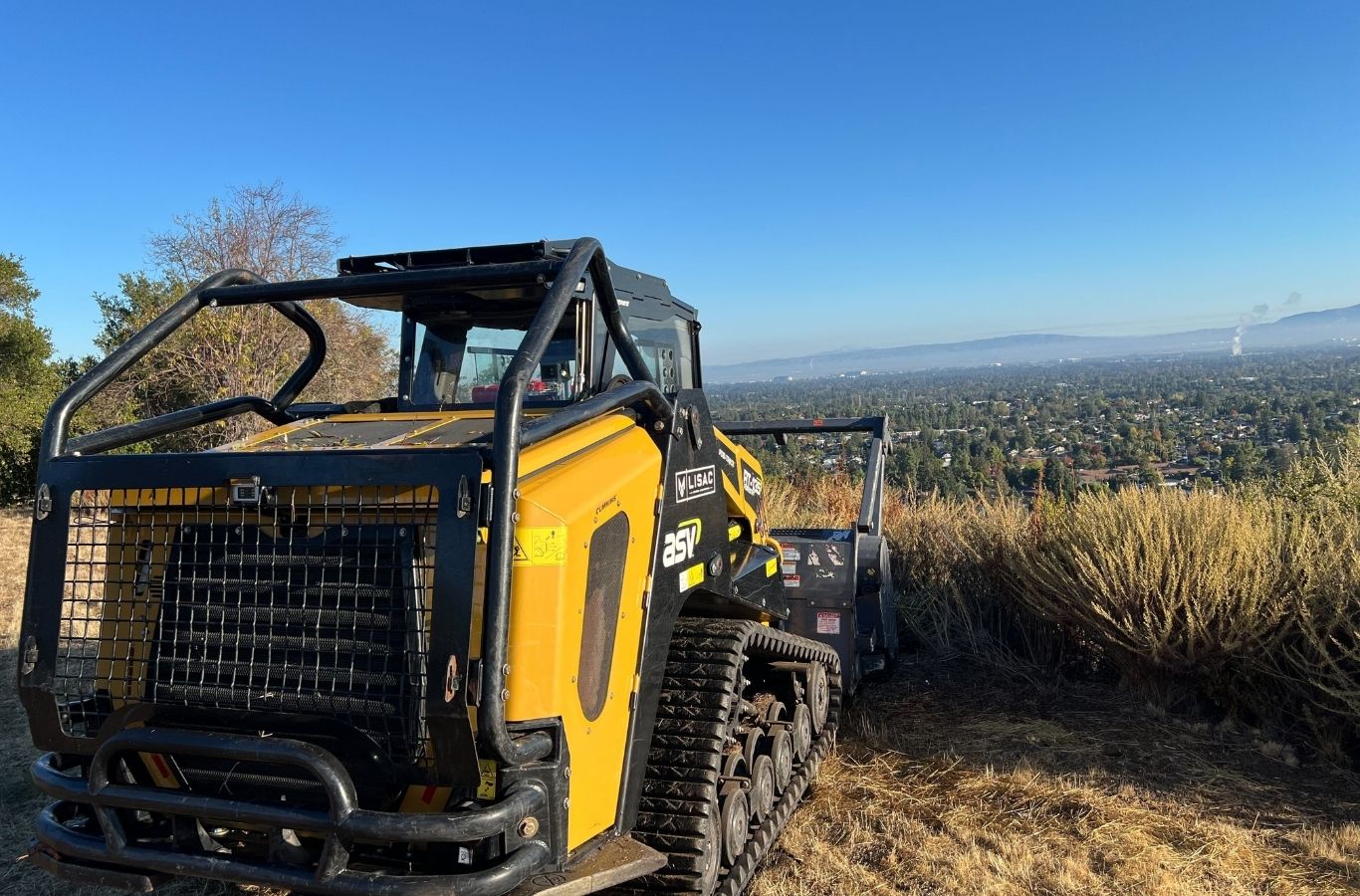 Lisac General Engineering team clearing land in Bay Area with advanced machinery for efficient and safe site preparation.