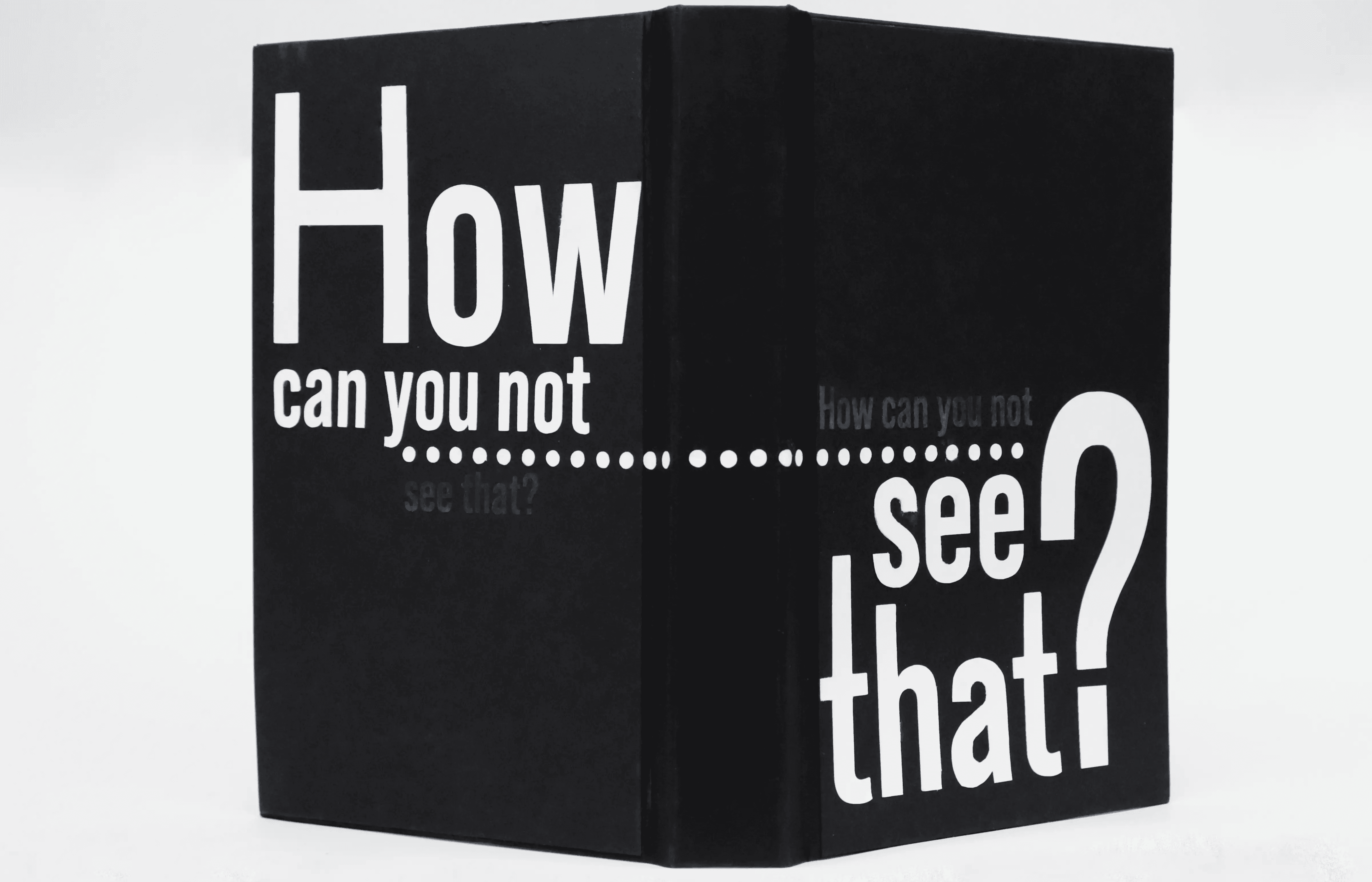 Open cover from behind, highlighting "How can you not" on the back cover and "see that?" on the front cover