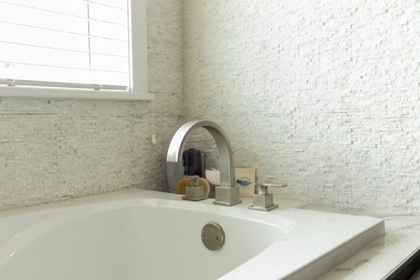 White bathtub stucco walls