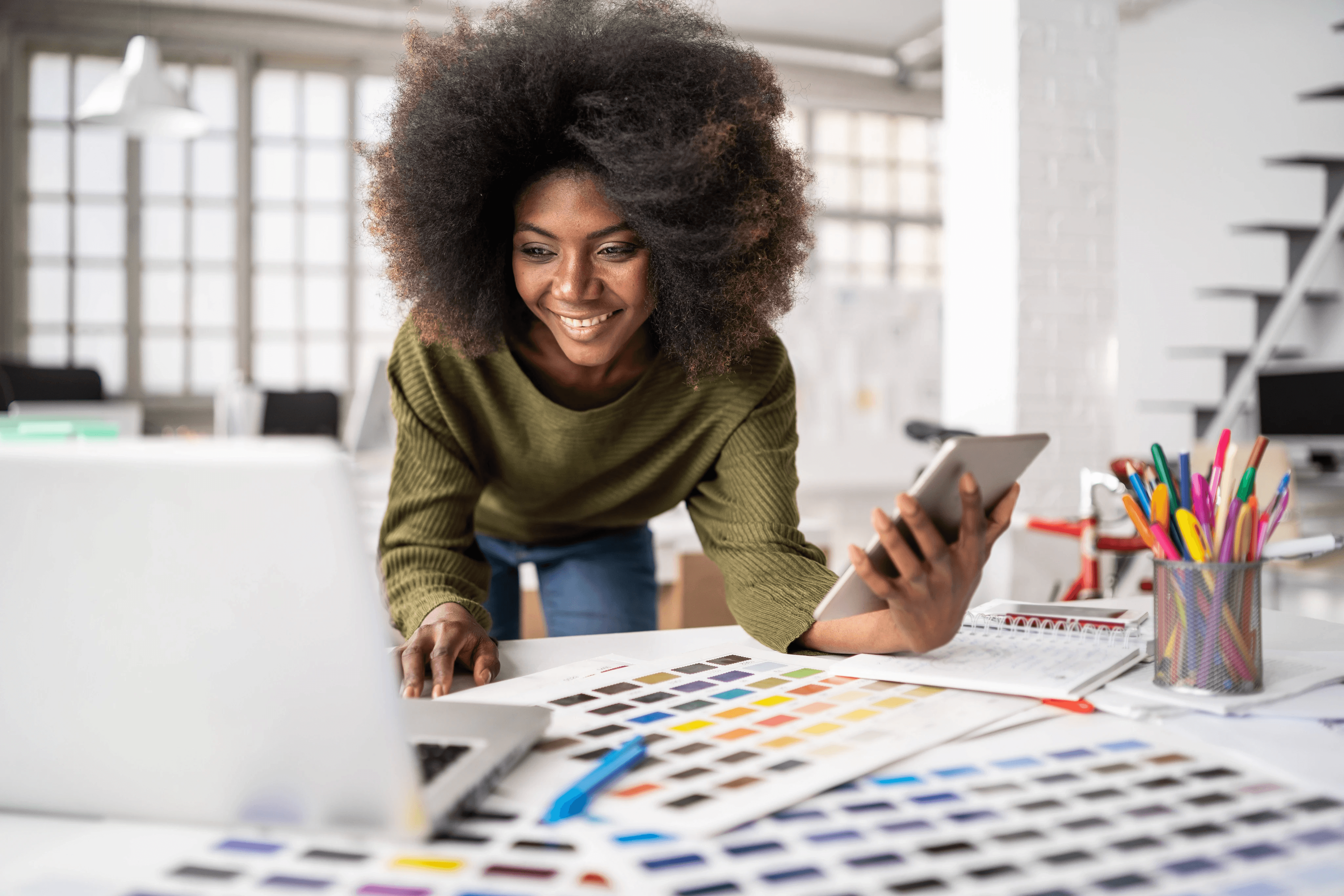 Designer reviewing color swatches and design options on a desk