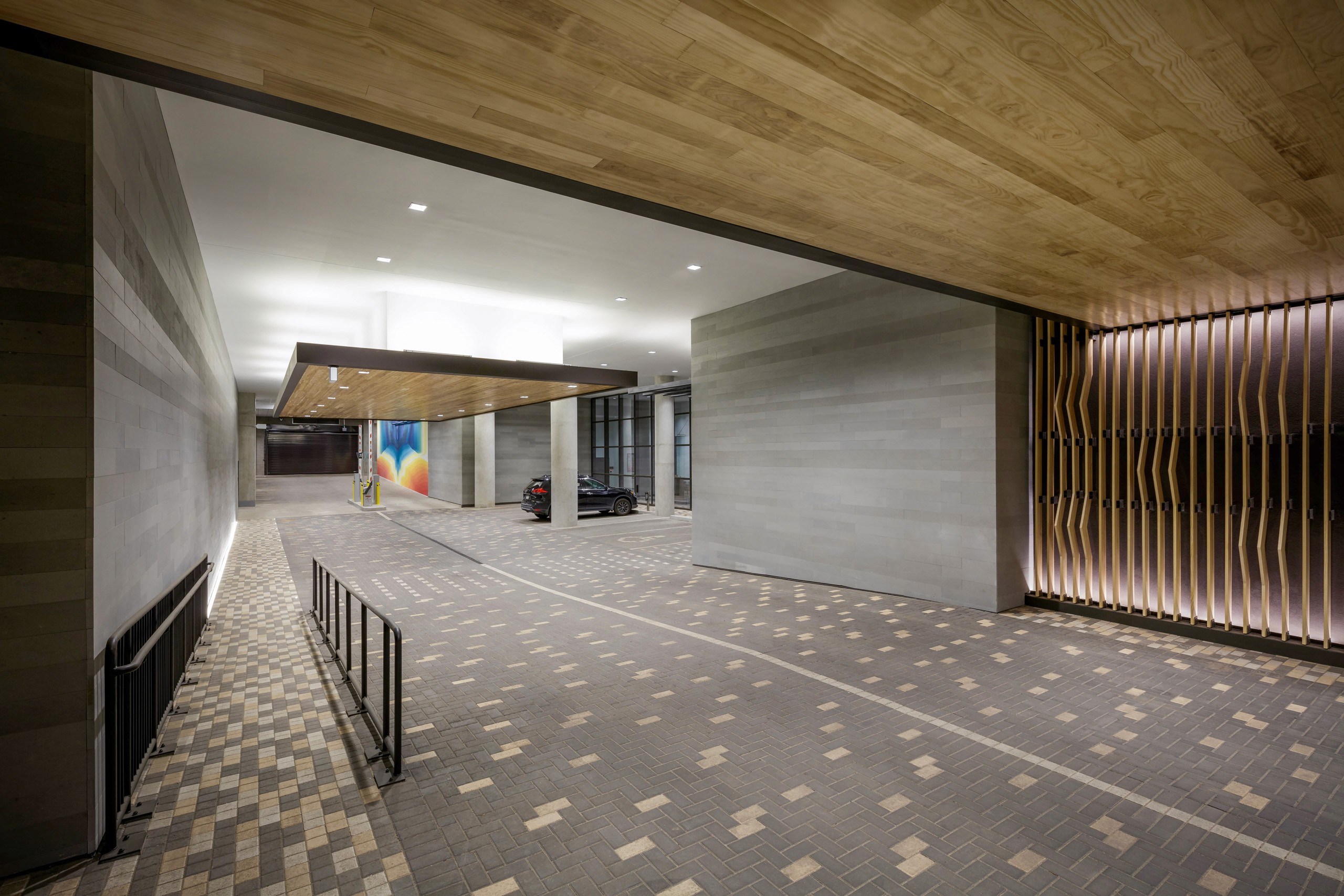 Modern entryway with wood ceiling and tiled floor.