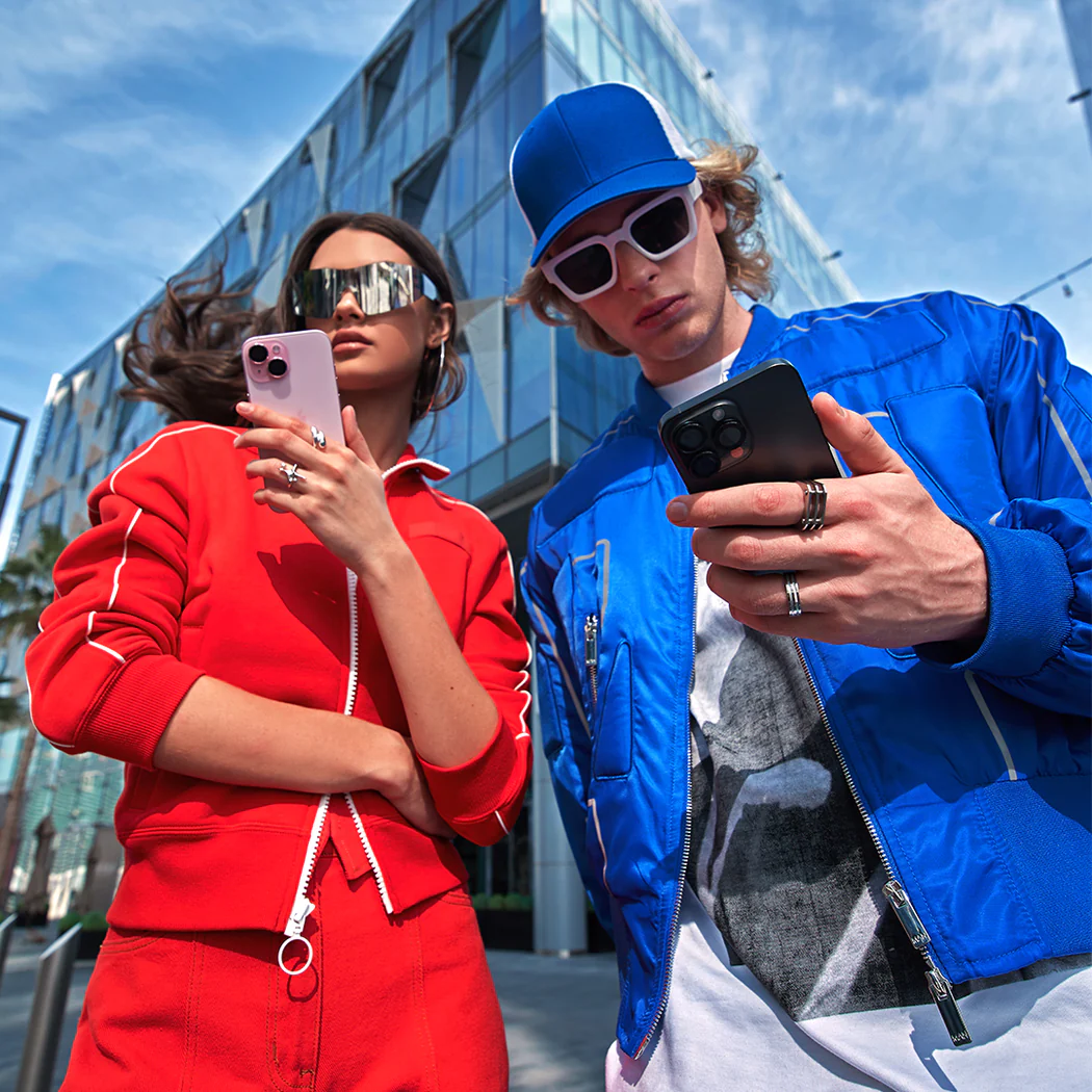 Two people holding mobile phones