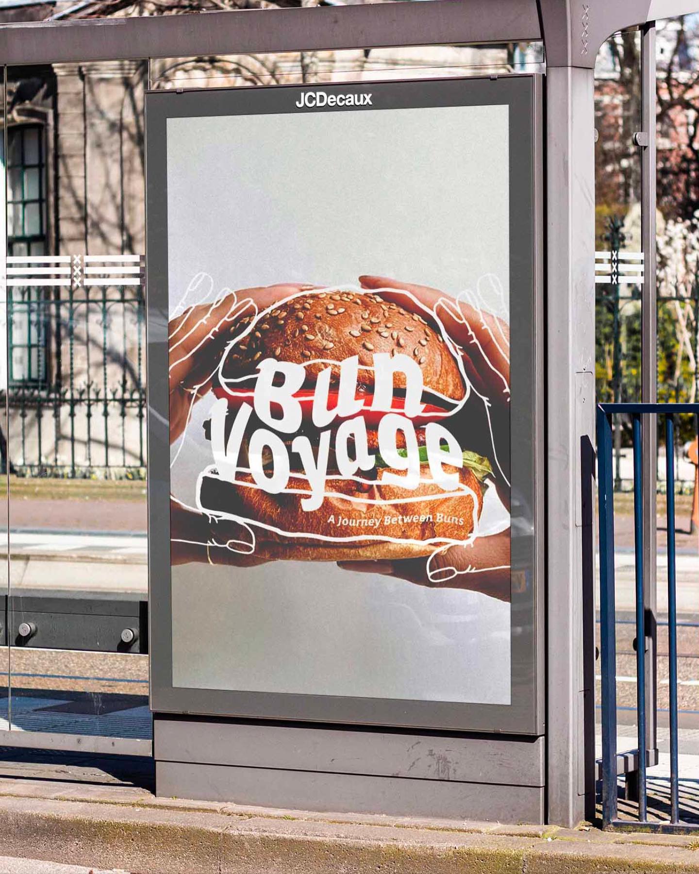 "Bun Voyage" advertisement poster displayed at a bus stop.