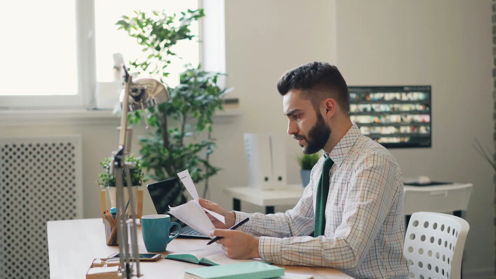 Immigration lawyer reviewing forms on a laptop with AI assistance