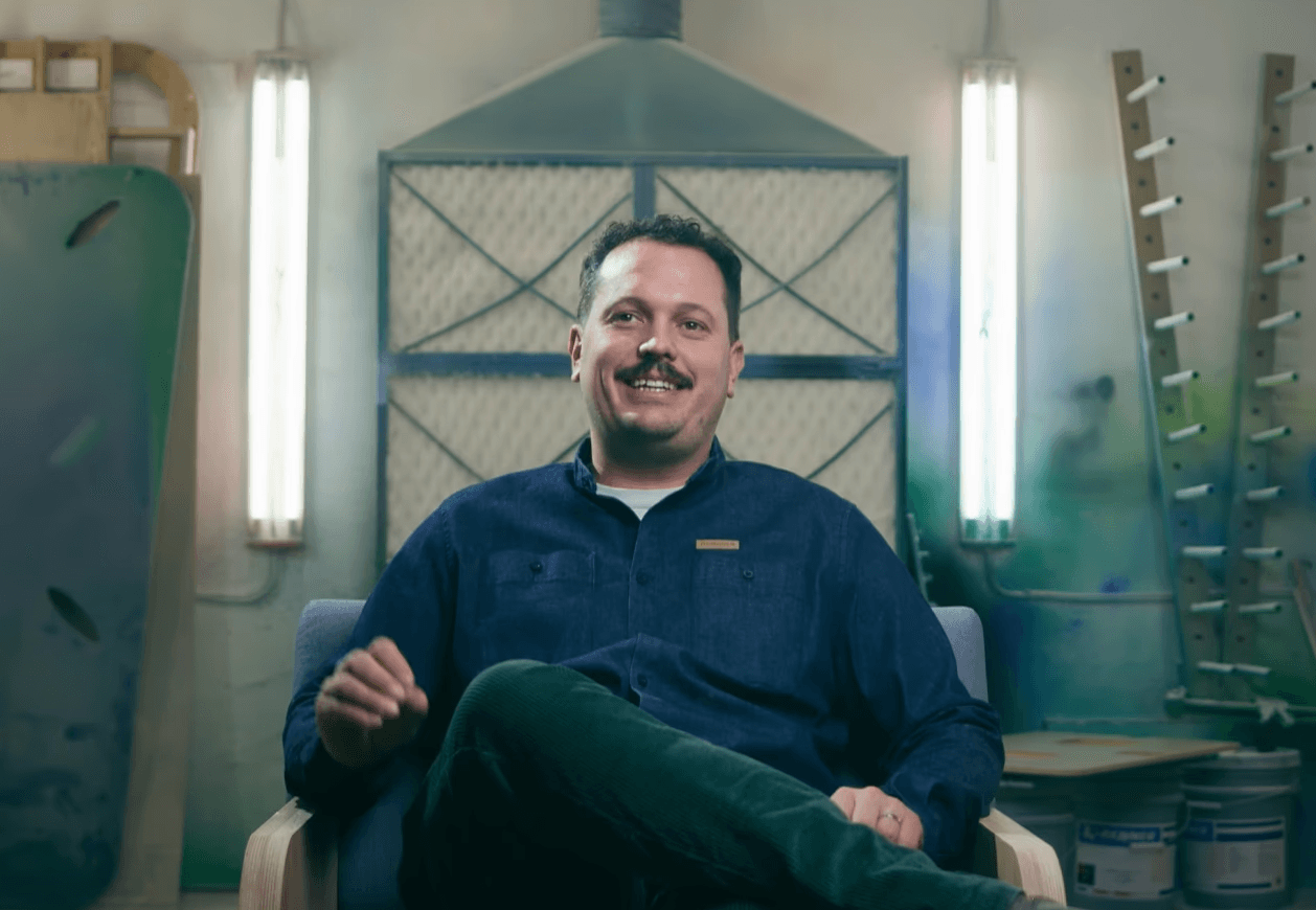 A man sitting being interviewed 