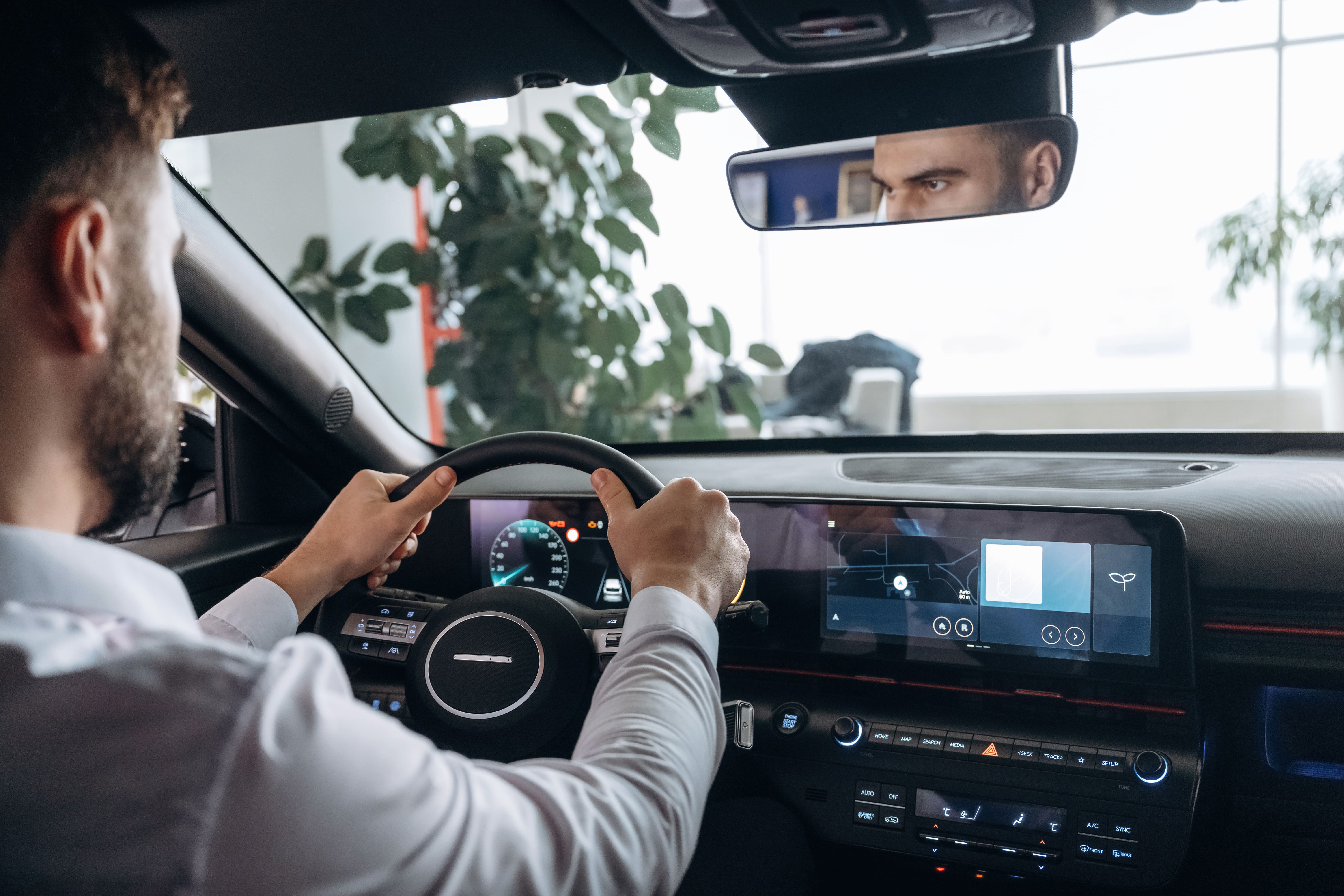 man-at-the-wheel-of-electric-car-with-adas-systems