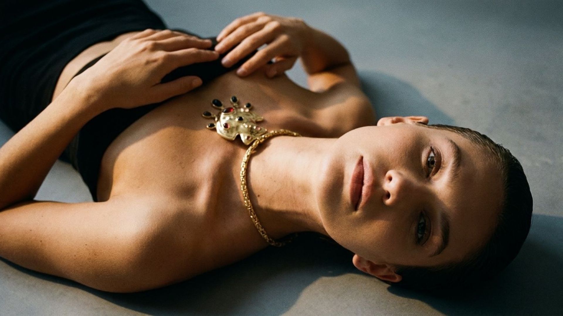 ai model lying on the floor for a jewelry photoshoot