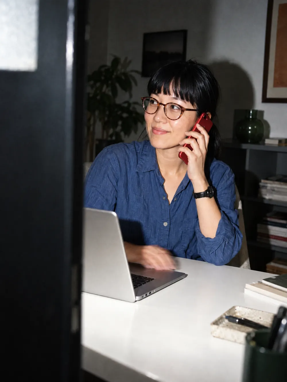 A Flexiti team member on a phone call at her desk