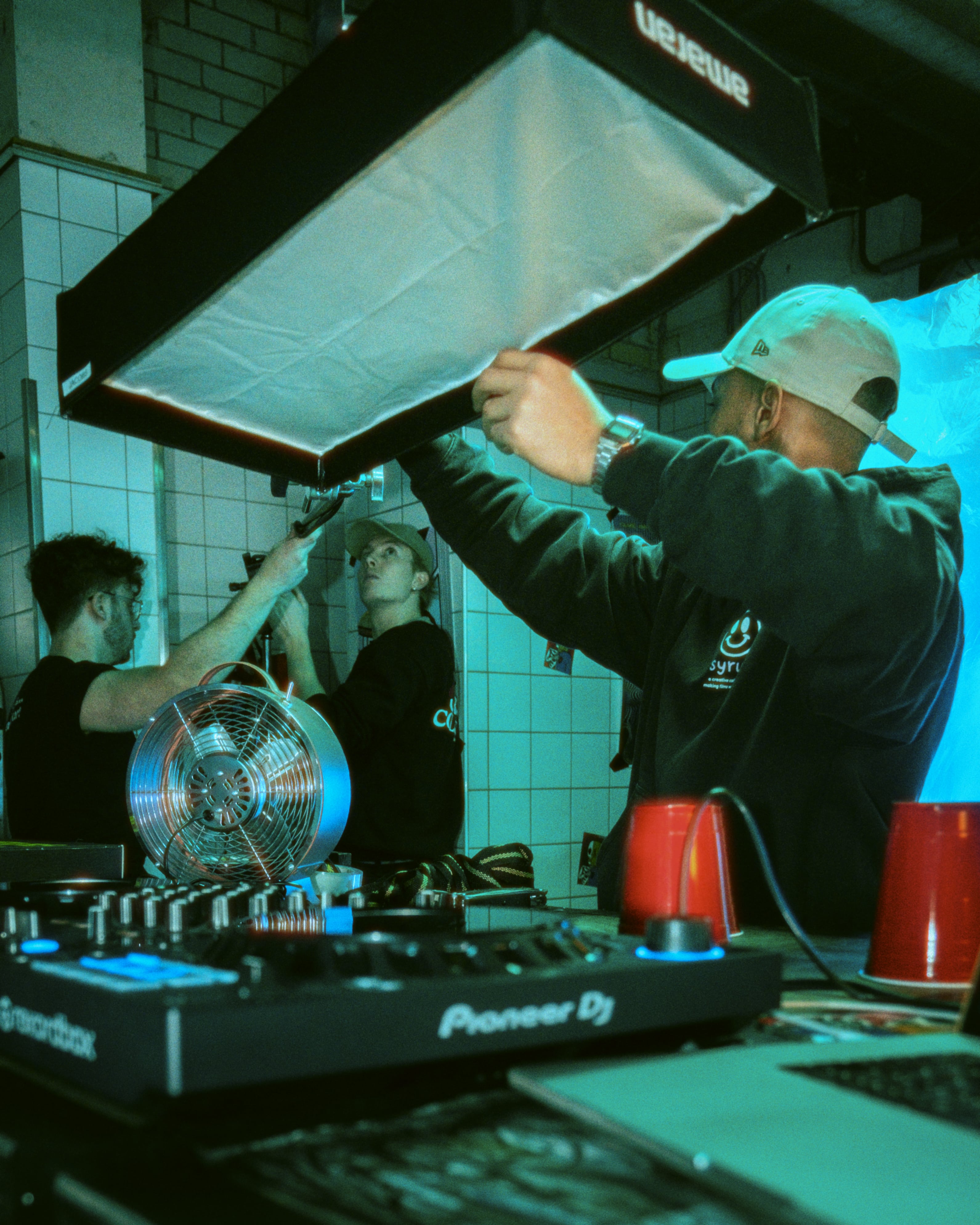 Streetside billboard with flyposters of the Batch.Works brand and illustrations