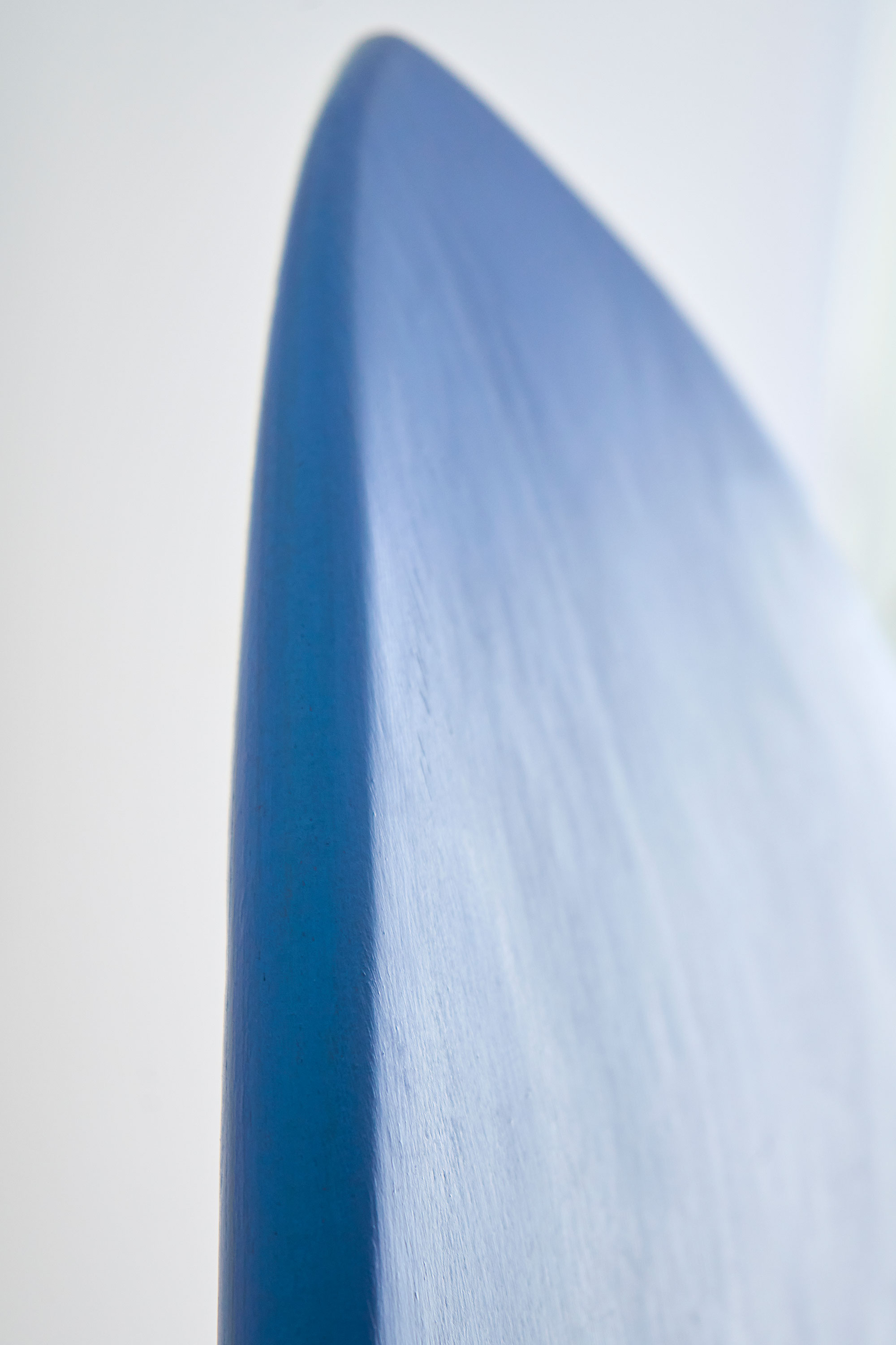 Blue stained timber surfboard
