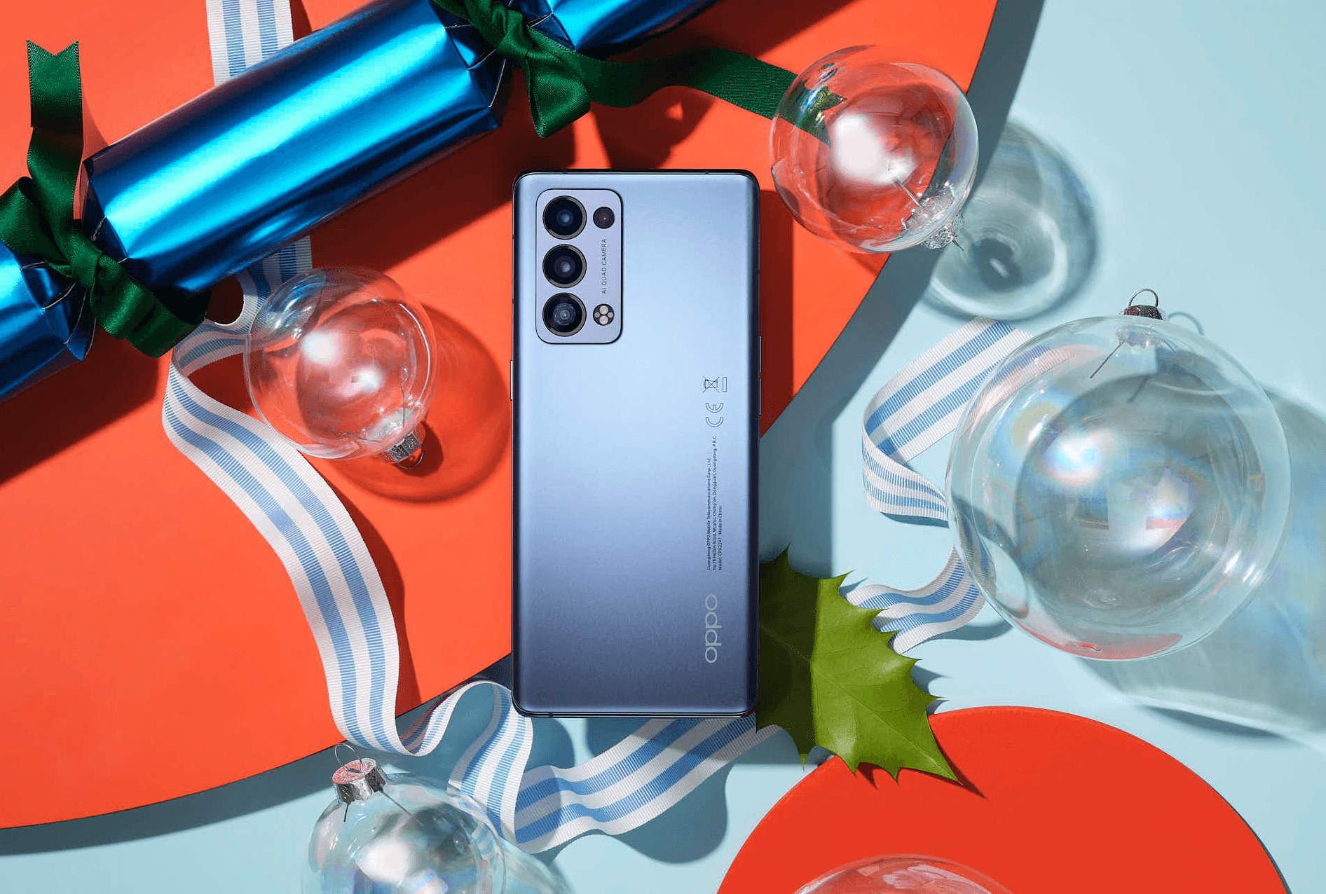 Blue smartphone on colorful holiday-themed background with ornaments.