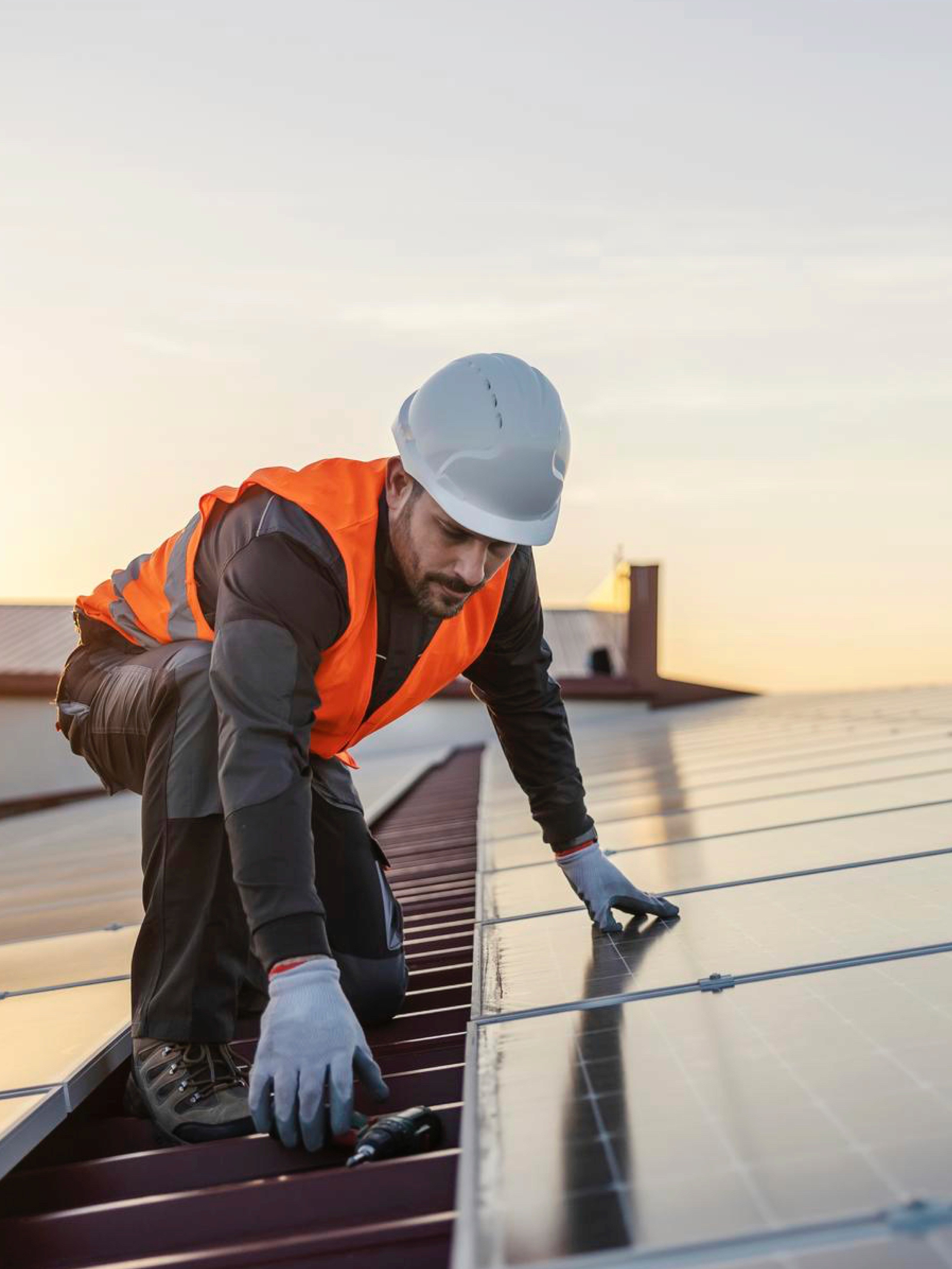 two ladies looking at a laptop and smiling