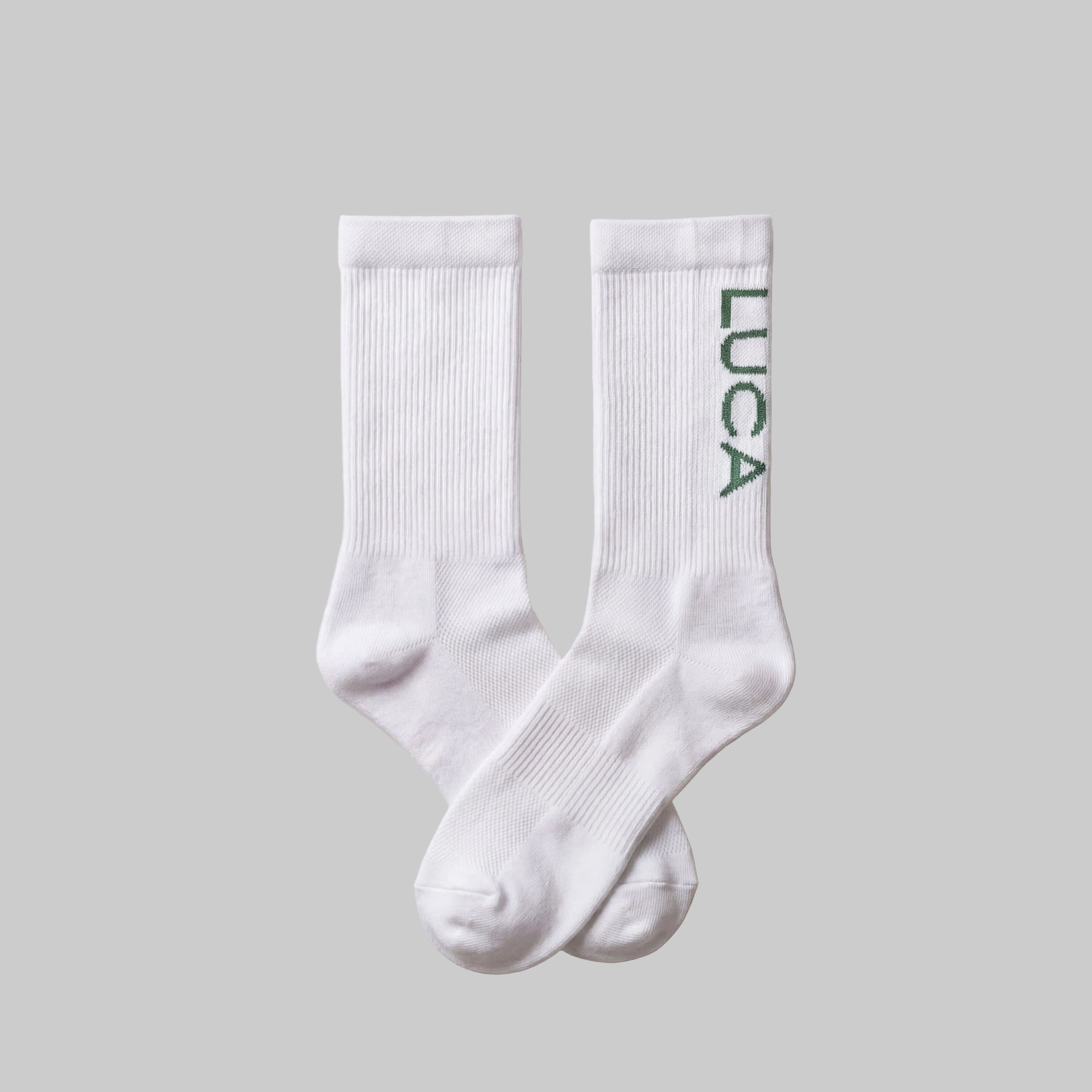 LUCA Traction long cycling socks in matcha colourway, flat lay