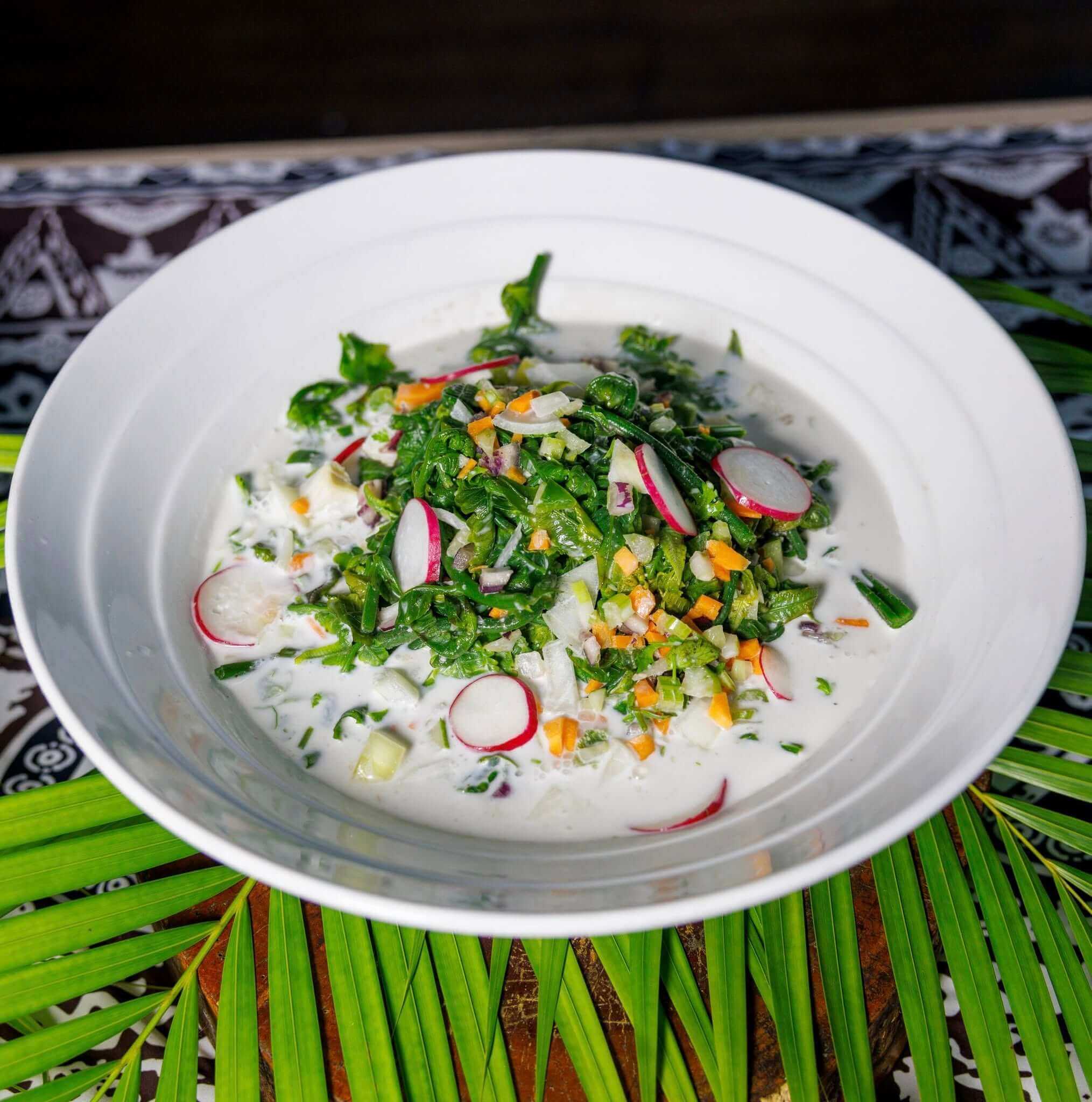 A traditional Fijian dish
with coconut sauce, greens and other veggies