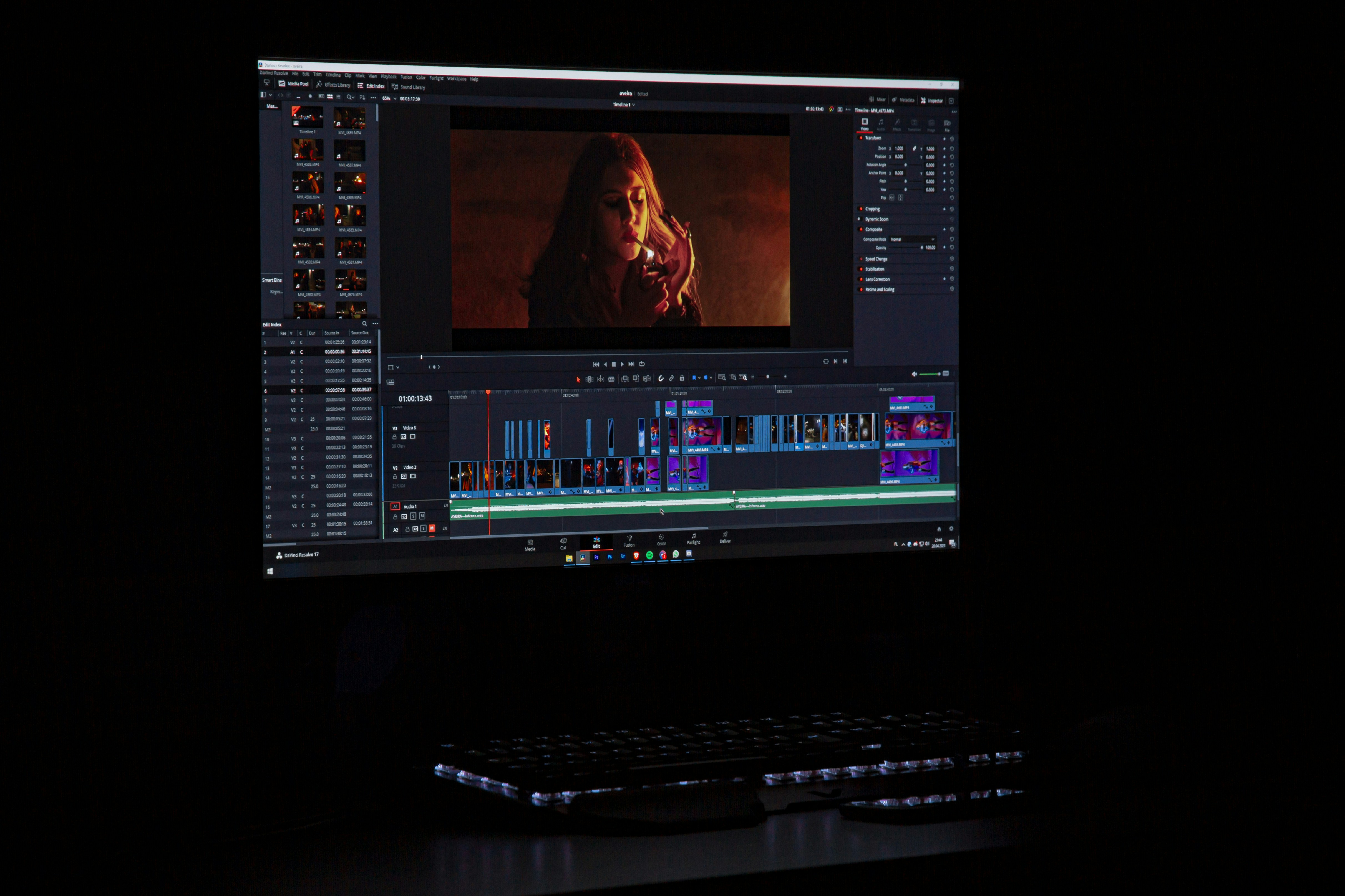 Video editing workspace showing cinematic footage and timeline inside Premiere Pro on a dark setup