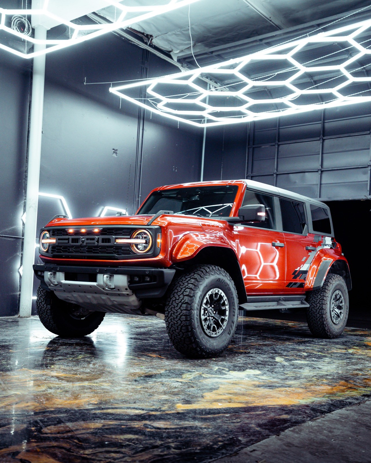 Glossy red Ford Bronco Raptor freshly protected in Dragon Auto shop