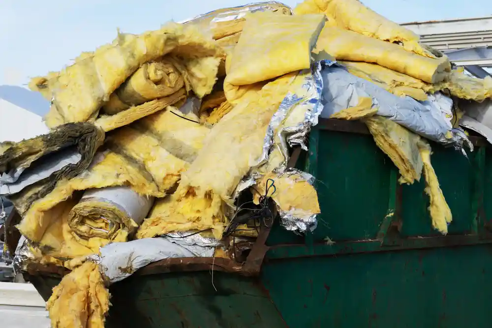 Old damaged insulation removed and in the trash
