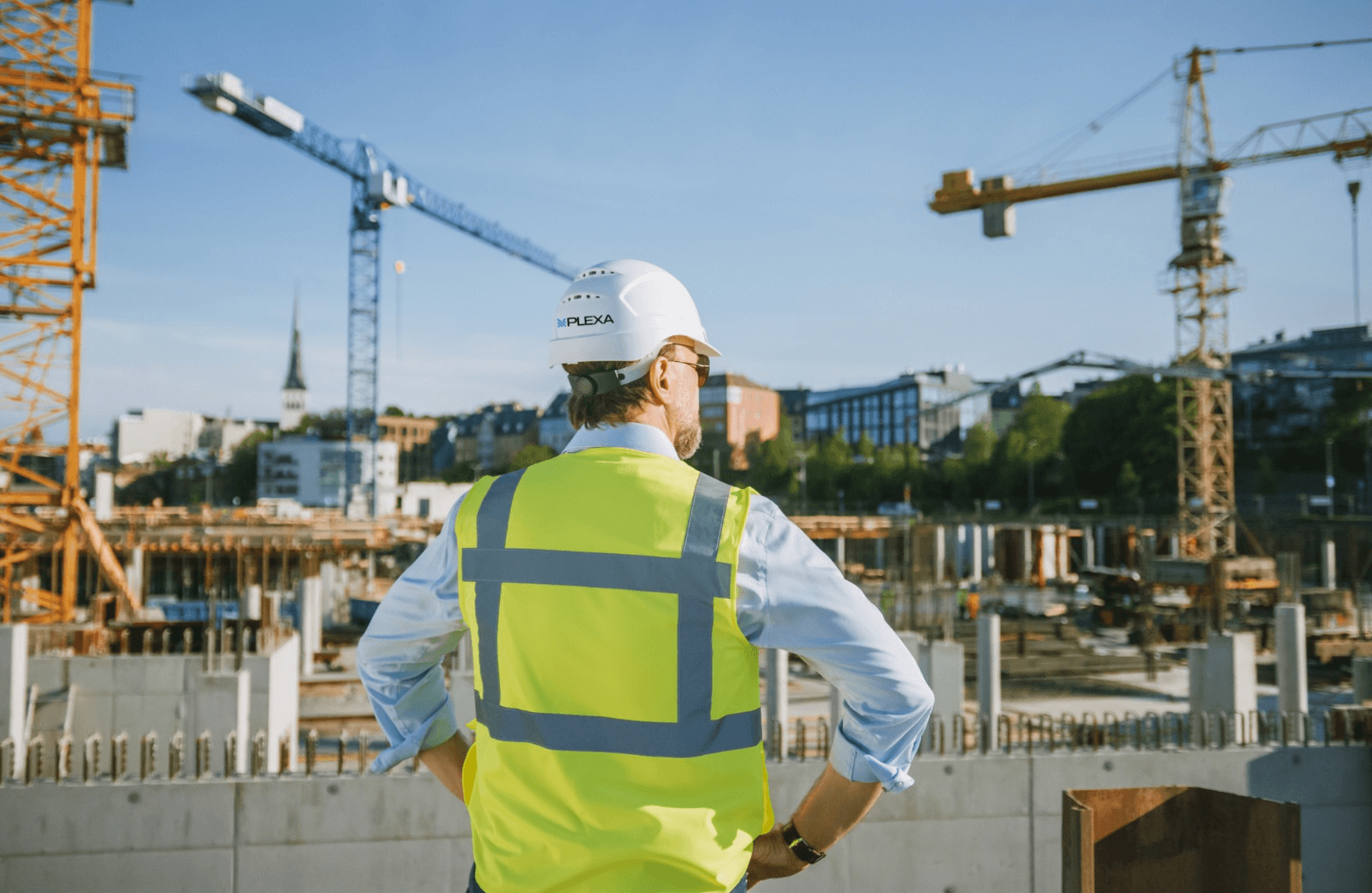 Man standing looking a construction site