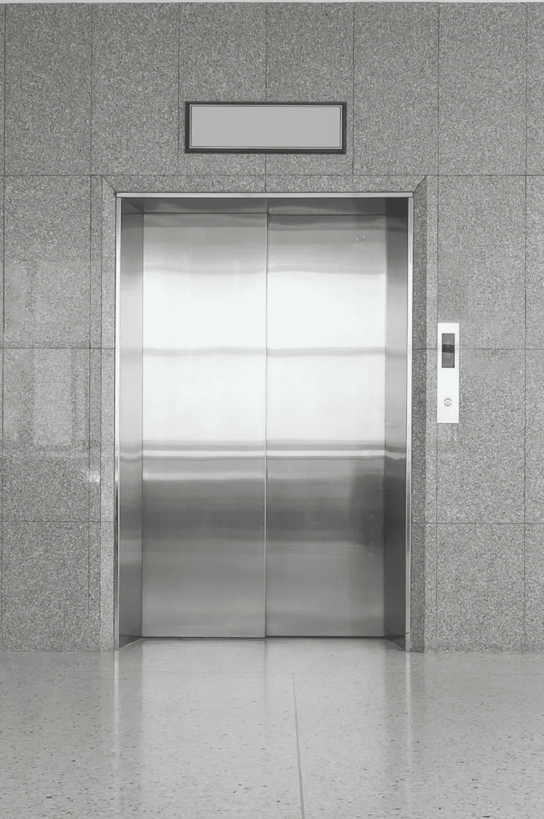 Electrician drilling in a wall