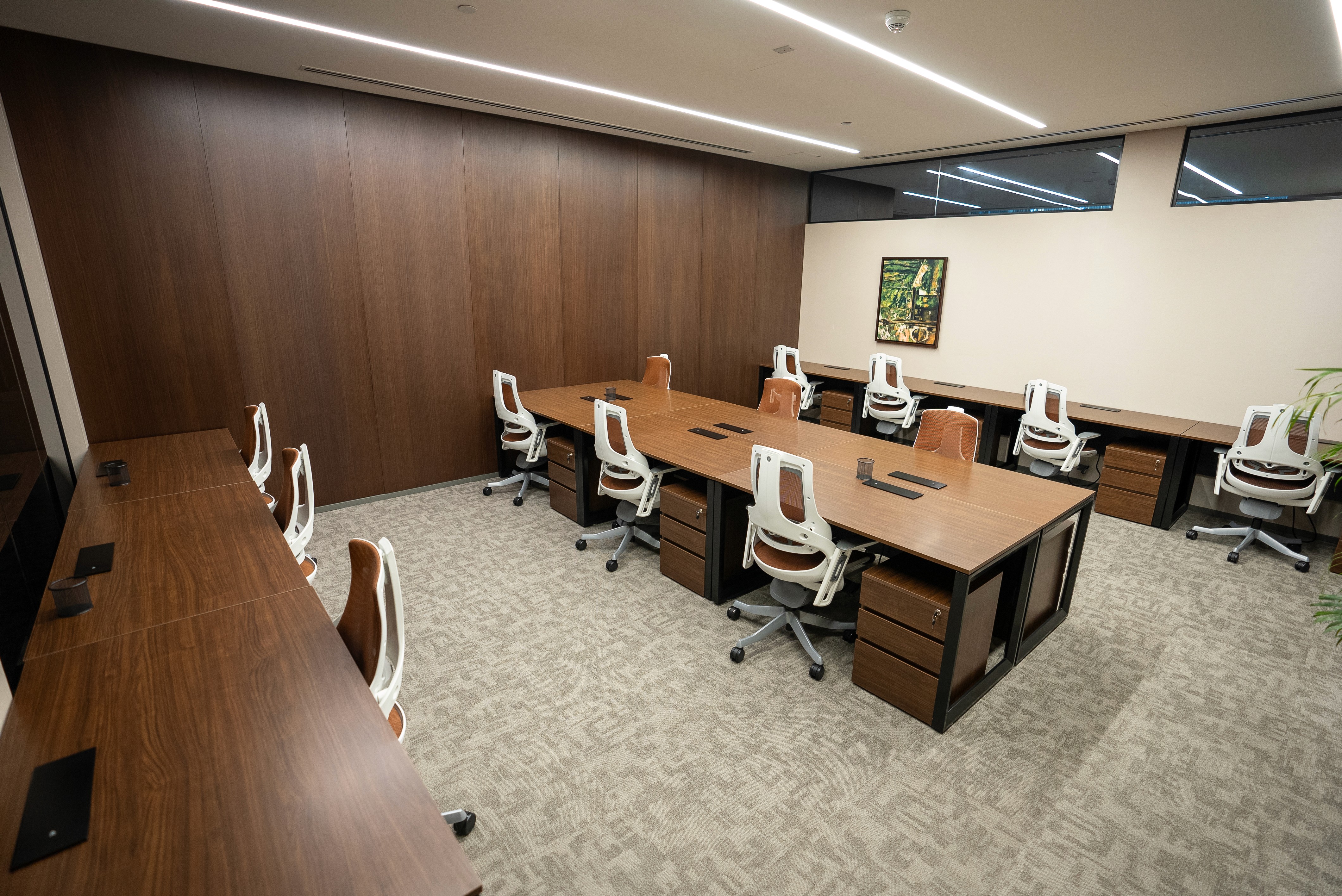 Contemporary office space featuring a comfortable work desk, file storage, and a sophisticated interior.