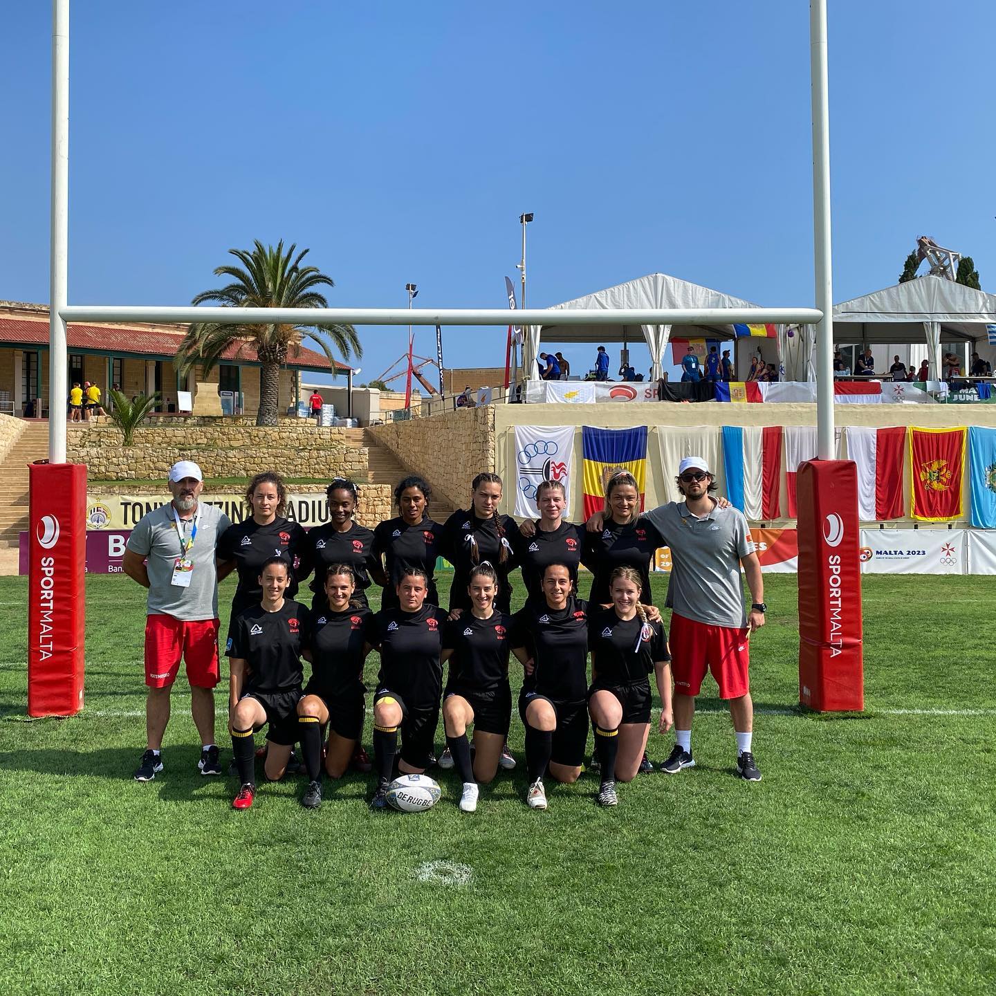 women rugby team in front of goal post