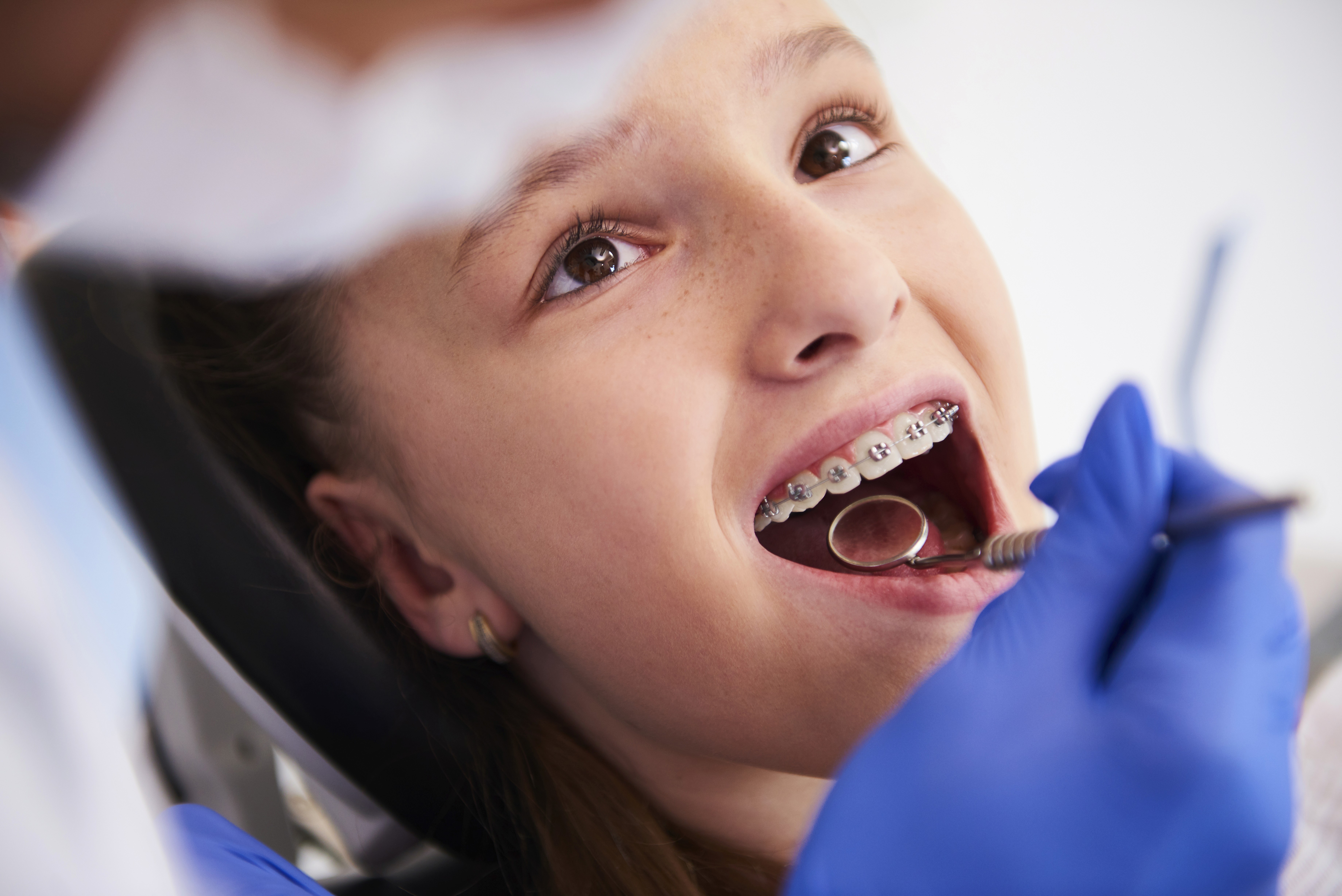 Female child sitting in a dentistry chair