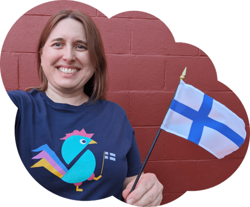 Person wearing Aapiskukko shirt and holding a Finnish flag