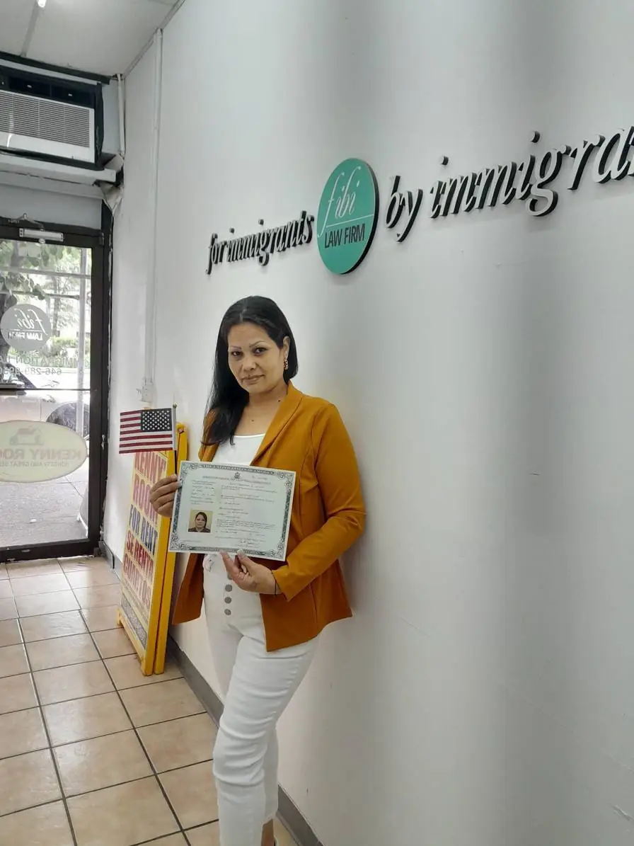 Cheerful young woman with work permit, assisted by Fibi Law