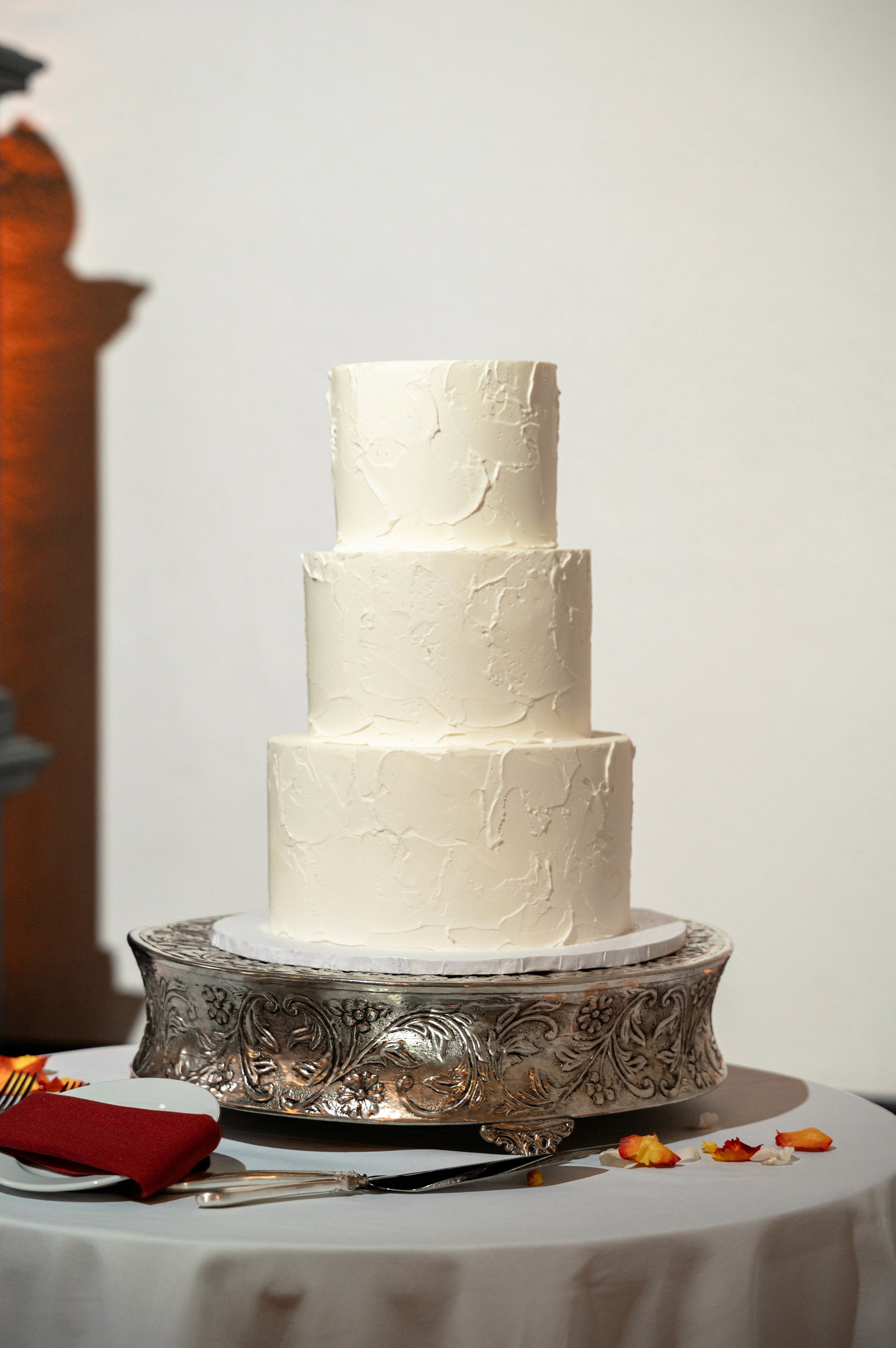 Flat lay wedding details with bouquet, rings, and sparkling bridal heels