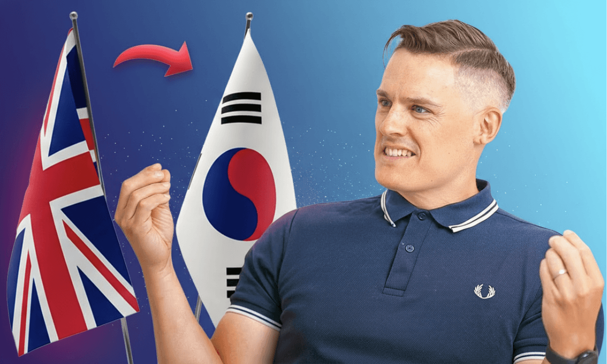 A man in a navy shirt gestures while smiling, with the UK flag on one side and the South Korean flag on the other, connected by a red arrow on a blue gradient background.