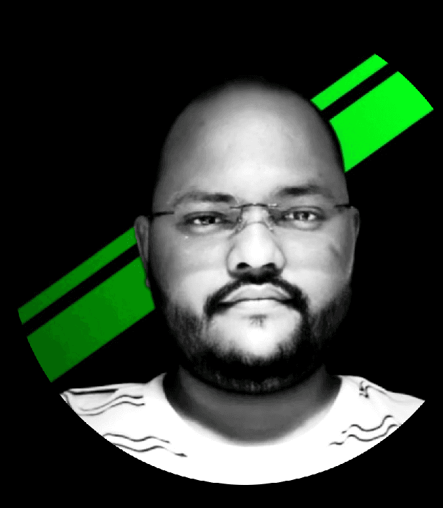 a man with a goatee smiles at the camera