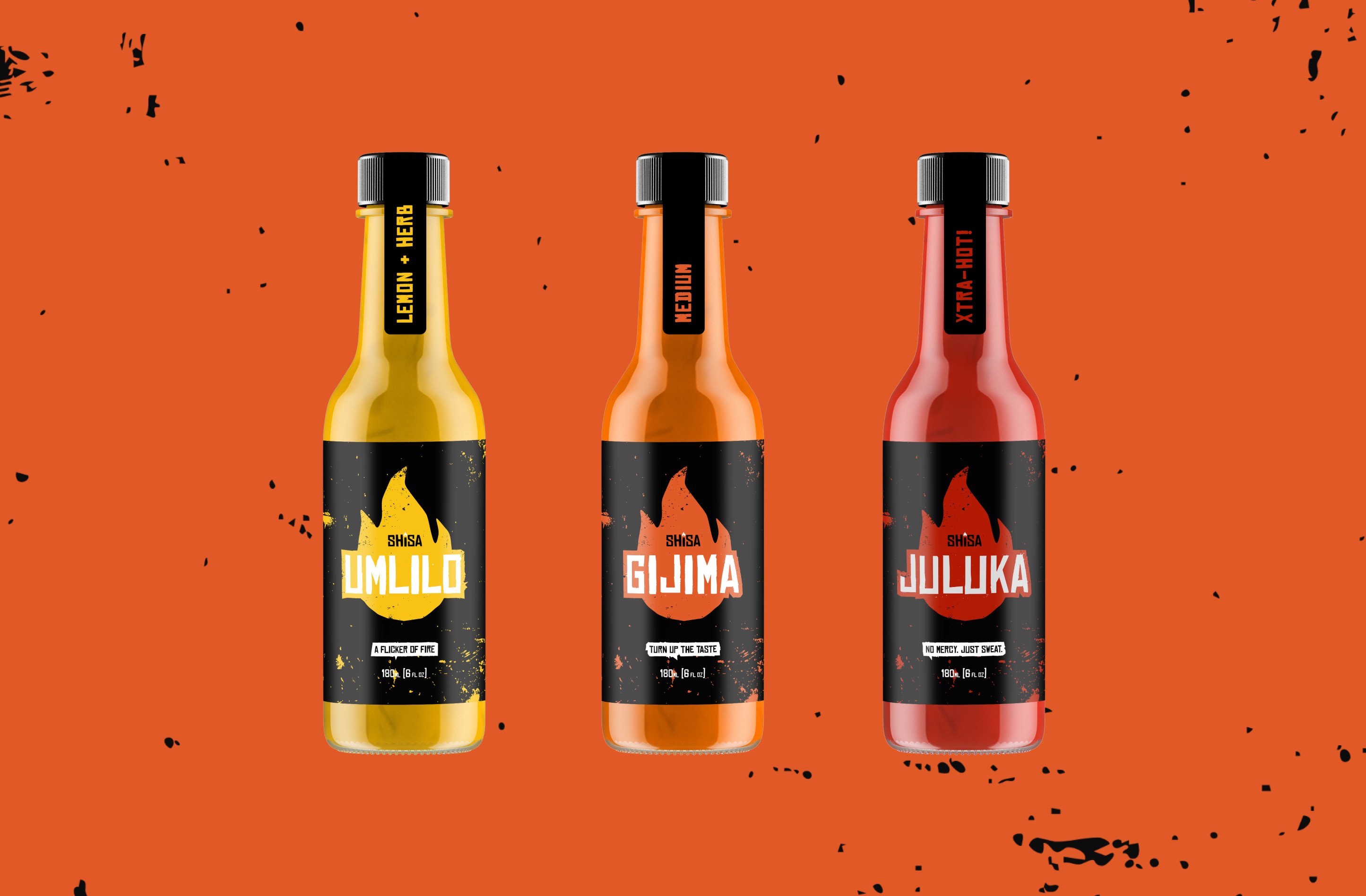 Three hot sauce bottles of different flavors on an orange background