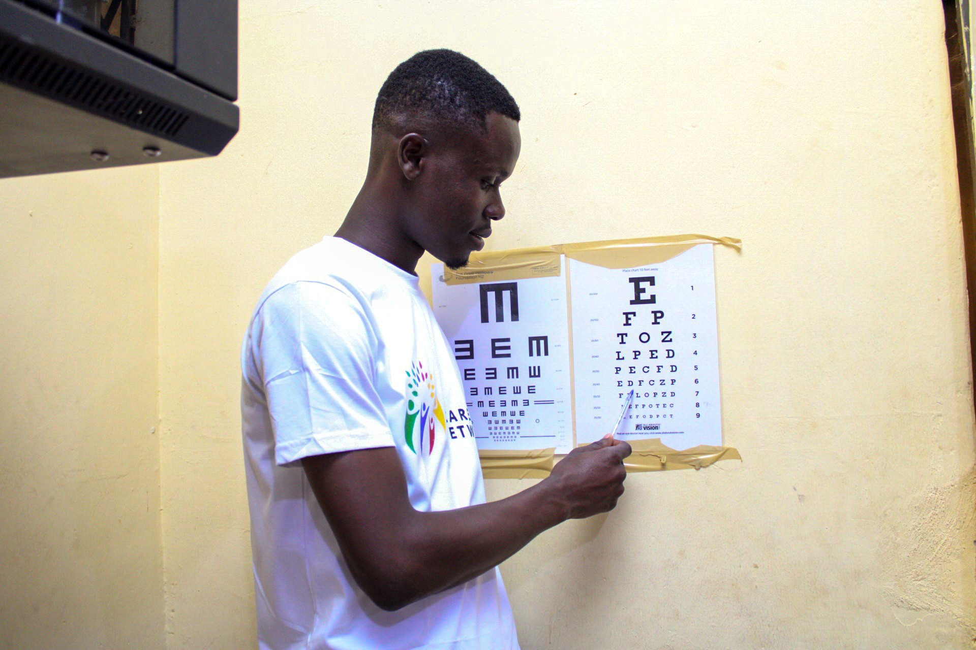 man in blue and white suit wearing black framed eyeglasses