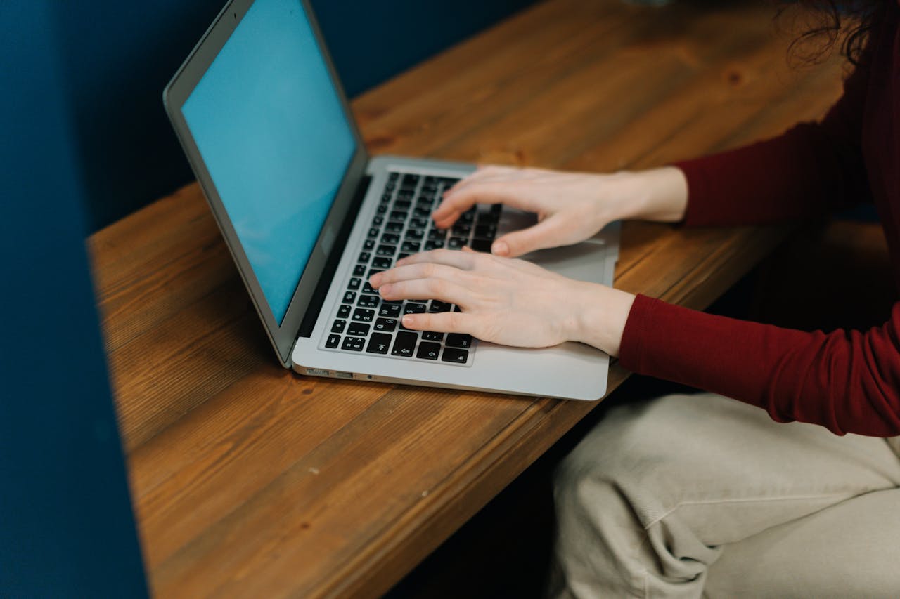 Two palm trees against a clear blue sky