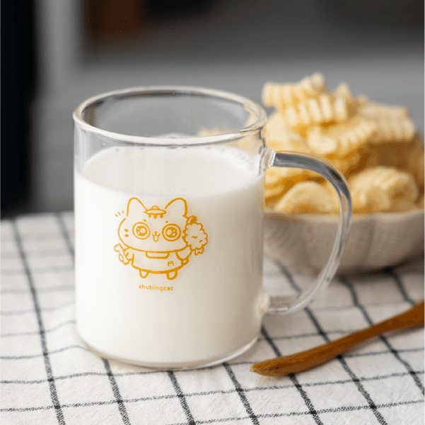 Close-up of lush, dark green leaves, some glossy and wet, against a muted background.