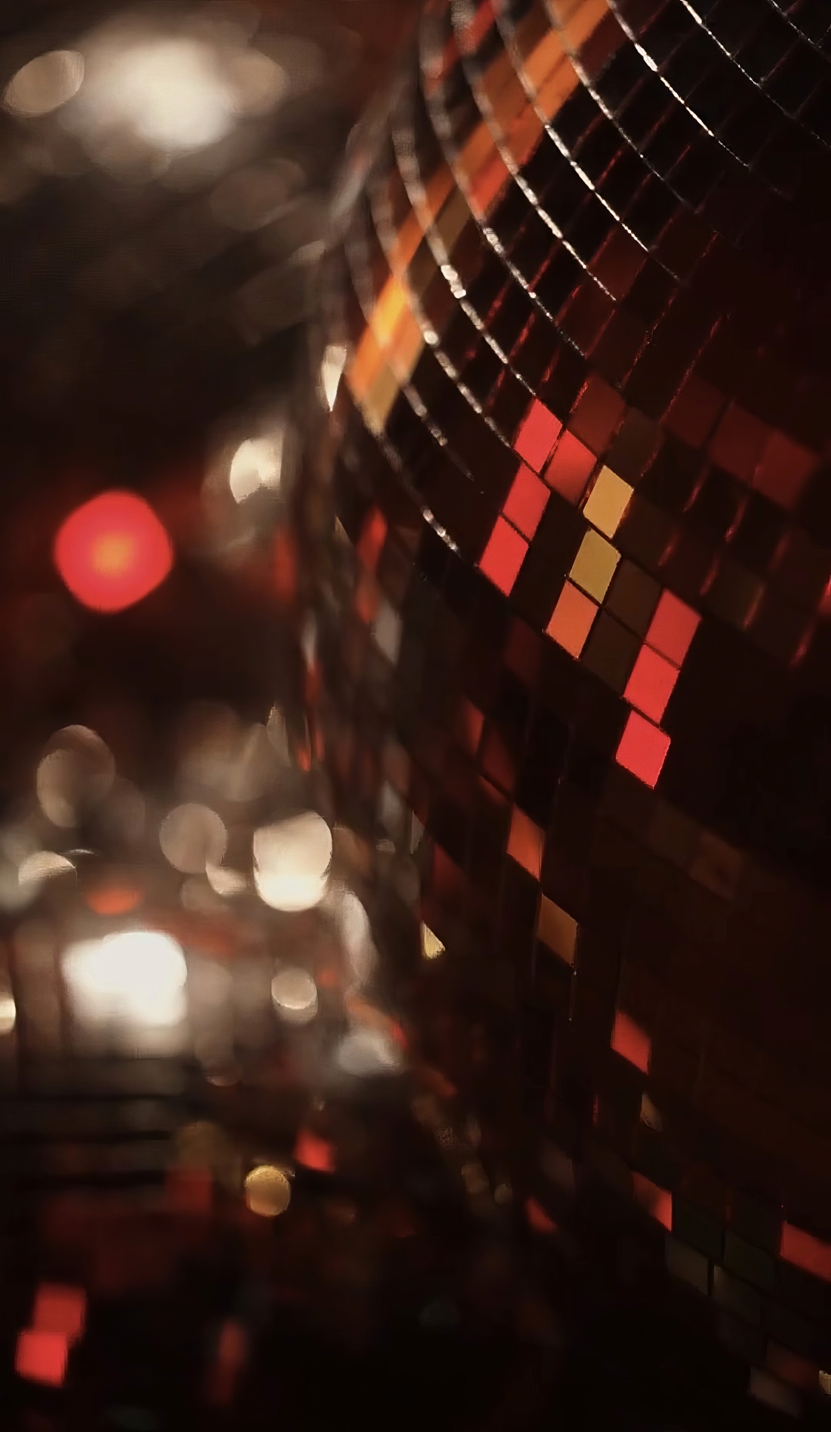 Bride and groom walking on street at night
