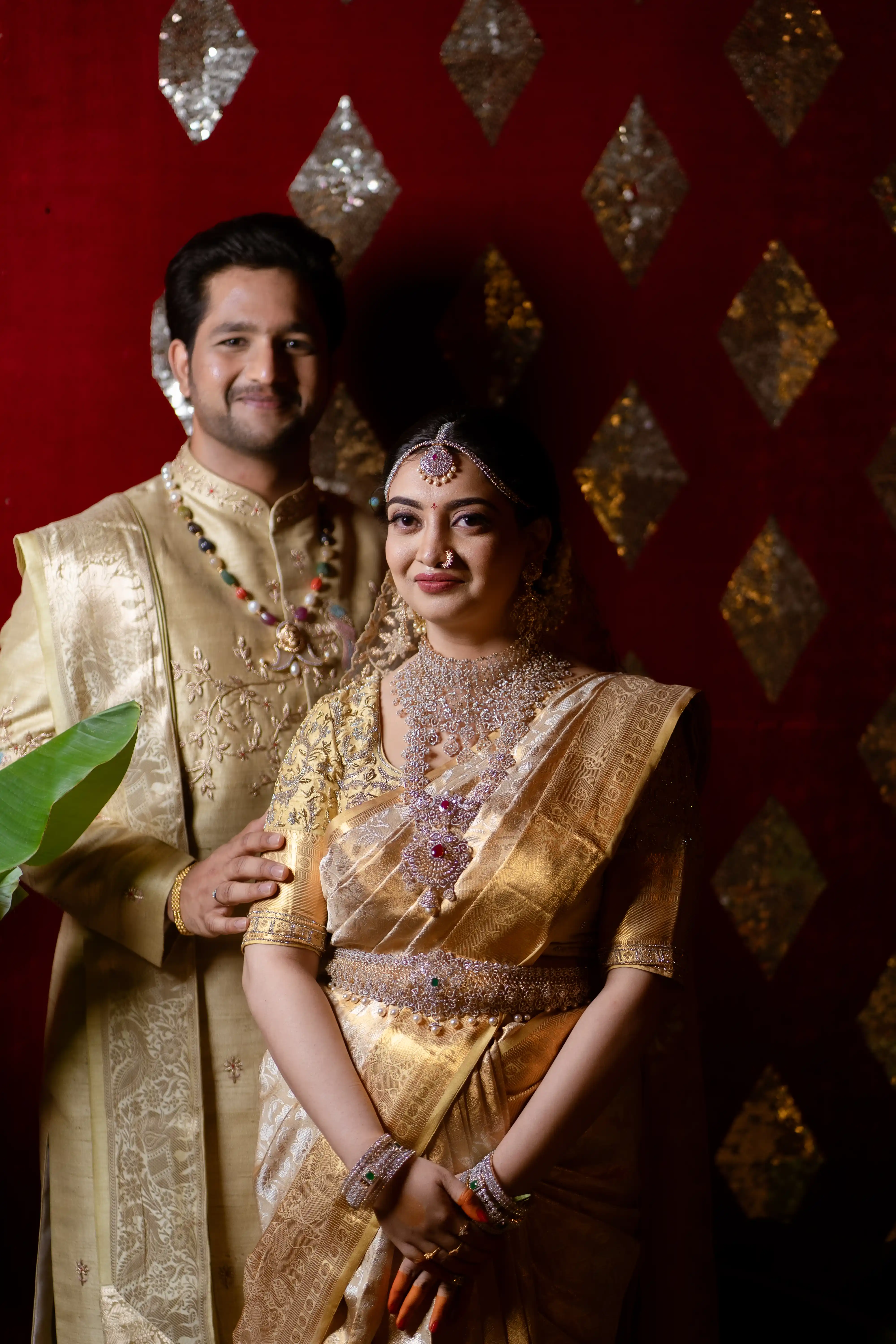 Priya & Vamsi in elegant Indian attire, beaming with joy. Fine Art Wedding Photography in Hyderabad by Out of The Blues.