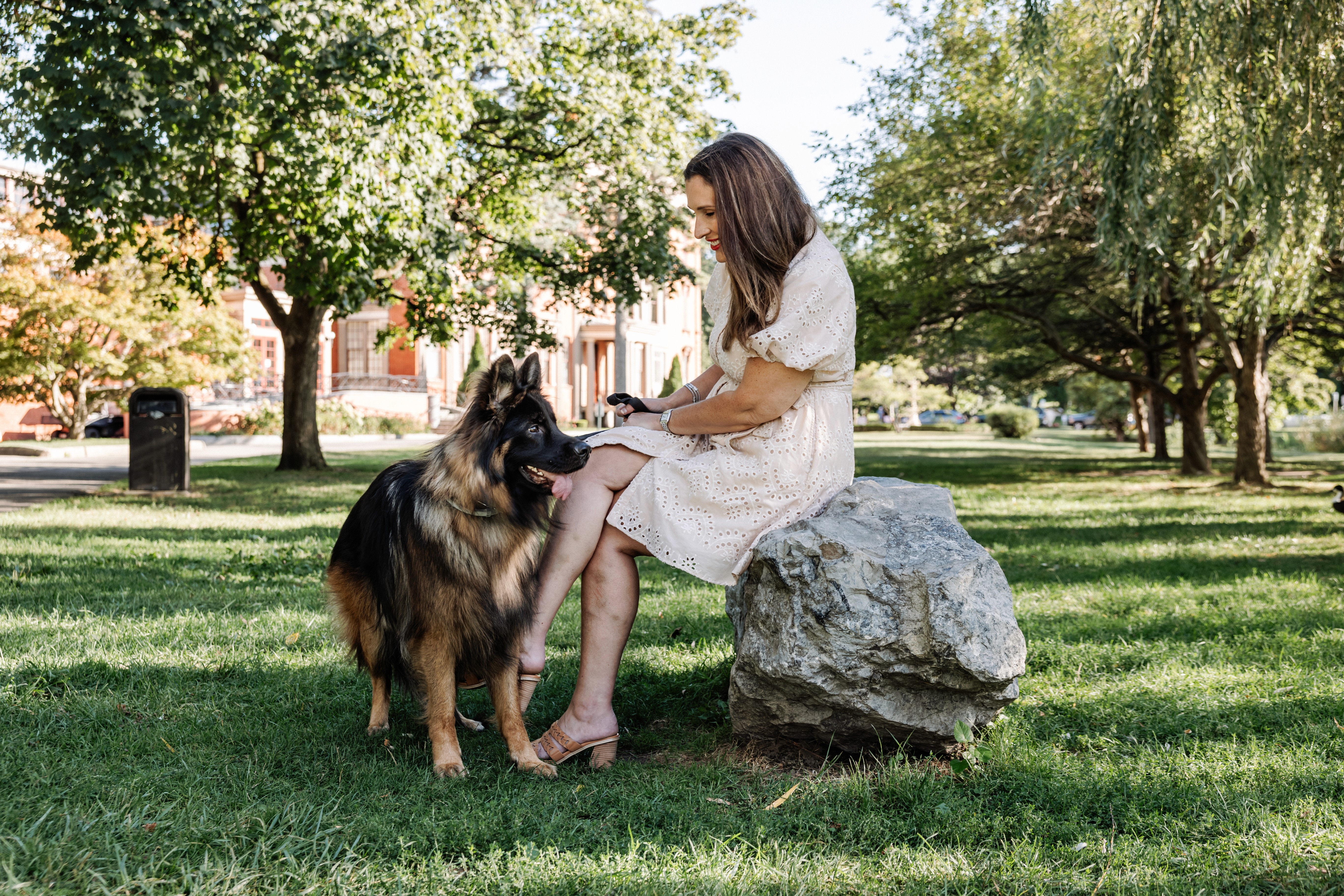 6:13 PMNewly engaged couple sitting on a stoop in the West Village, NYC bathed in warm golden hour light — romantic, candid golden hour engagement photography by Lizz Spano Photography, New York City engagement photographer.